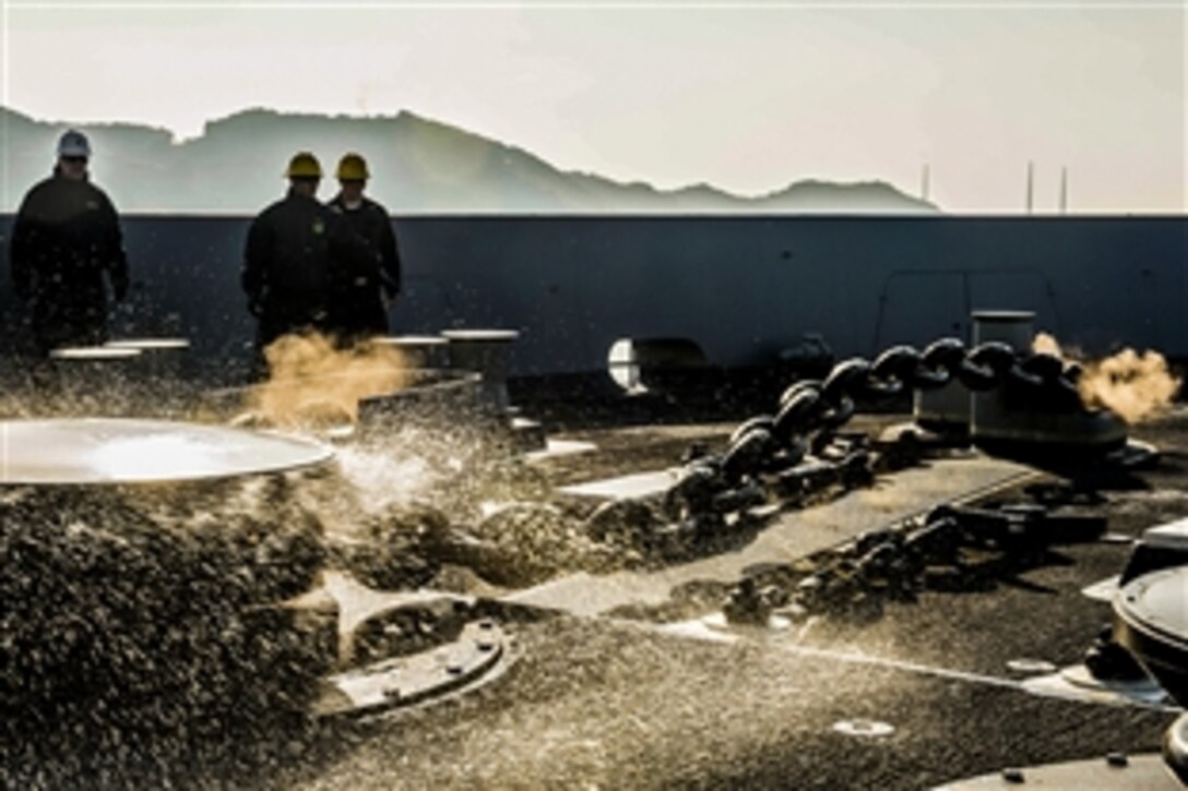 U.S. sailors aboard the amphibious transport dock ship USS Green Bay lower the ship's left anchor during training in Sasebo, Japan, March 2, 2015.