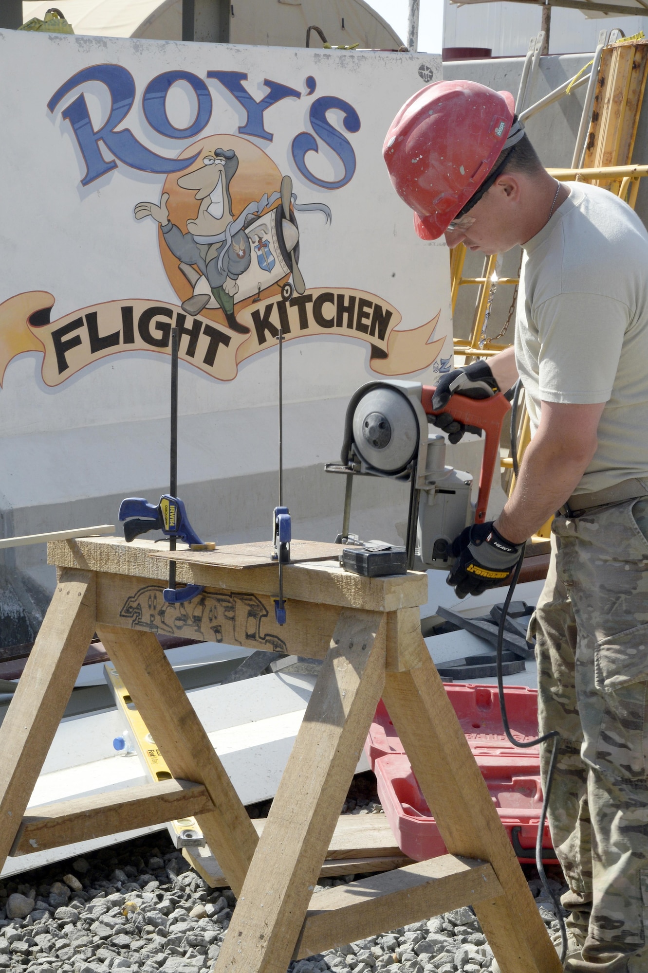 Staff Sgt. Eric, Expeditionary Prime Base Engineer Emergency Force Squadron structural craftsman, uses a portable band saw to cut metal plates at an undisclosed location in Southwest Asia Mar. 2, 2015. EPBS does cradle to grave construction consisting of small to medium construction projects from programming to real estate capitalization. Eric is currently deployed from the 434th Civil Engineer Squadron out of Grissom Air Reserve Base, Ind., and is a native of Machesney Park, Ill. (U.S. Air Force photo/Tech. Sgt. Marie Brown) (RELEASED)