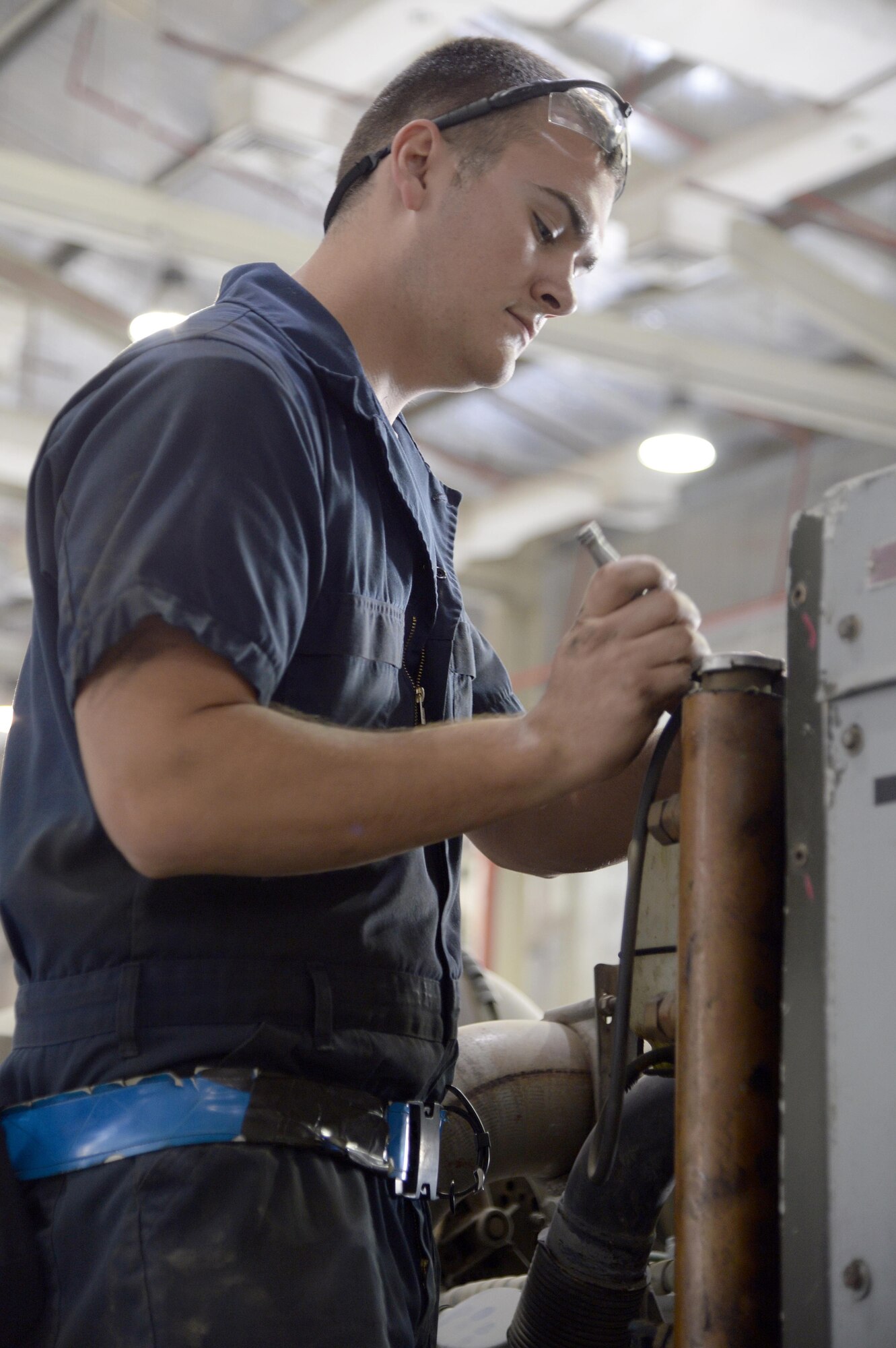 Senior Airman Michael, AGE journeyman, prepares an A/M32A-103 Generator for a periodic inspection at an undisclosed location in Southwest Asia Mar. 3, 2015. AGE Airmen maintain electrical systems, hydraulic systems, pneumatic systems, you name it but really aren’t masters of any one system. Michael is currently deployed from Hill Air Force Base, Utah and is a native of Burleson, Texas. (U.S. Air Force photo/Tech. Sgt. Marie Brown) (RELEASED)