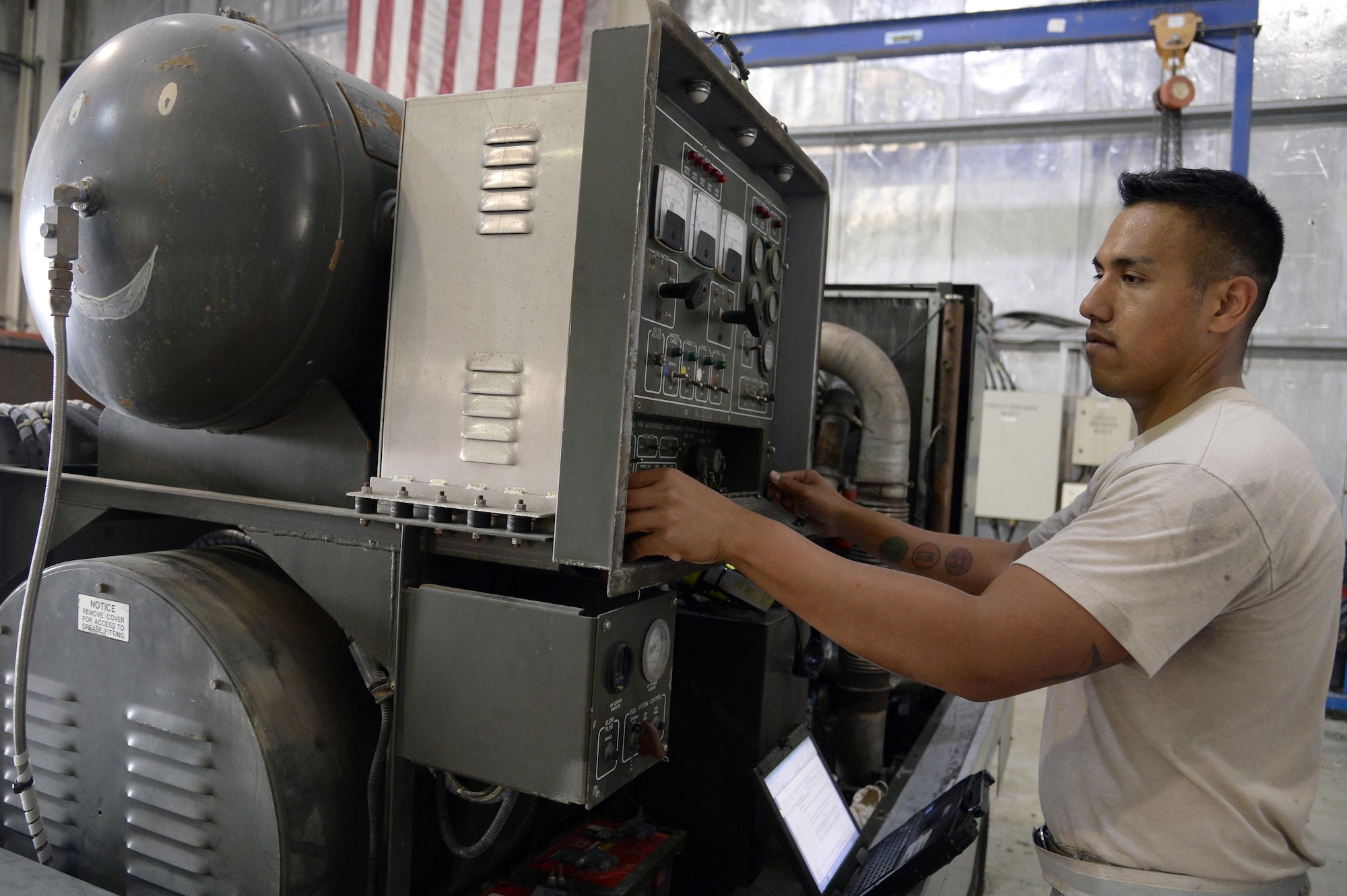 Staff Sgt. Jaime, aerospace ground equipment, performs a phase 2 inspection on an A/M32A-103 Generator at an undisclosed location in Southwest Asia Mar. 4, 2015. Maintenance was done to check for loose hardware. Jaime is currently deployed from Tinker Air Force Base, Okla., and is native of Oklahoma City, Okla. (U.S. Air Force photo/Tech. Sgt. Marie Brown) (RELEASED)