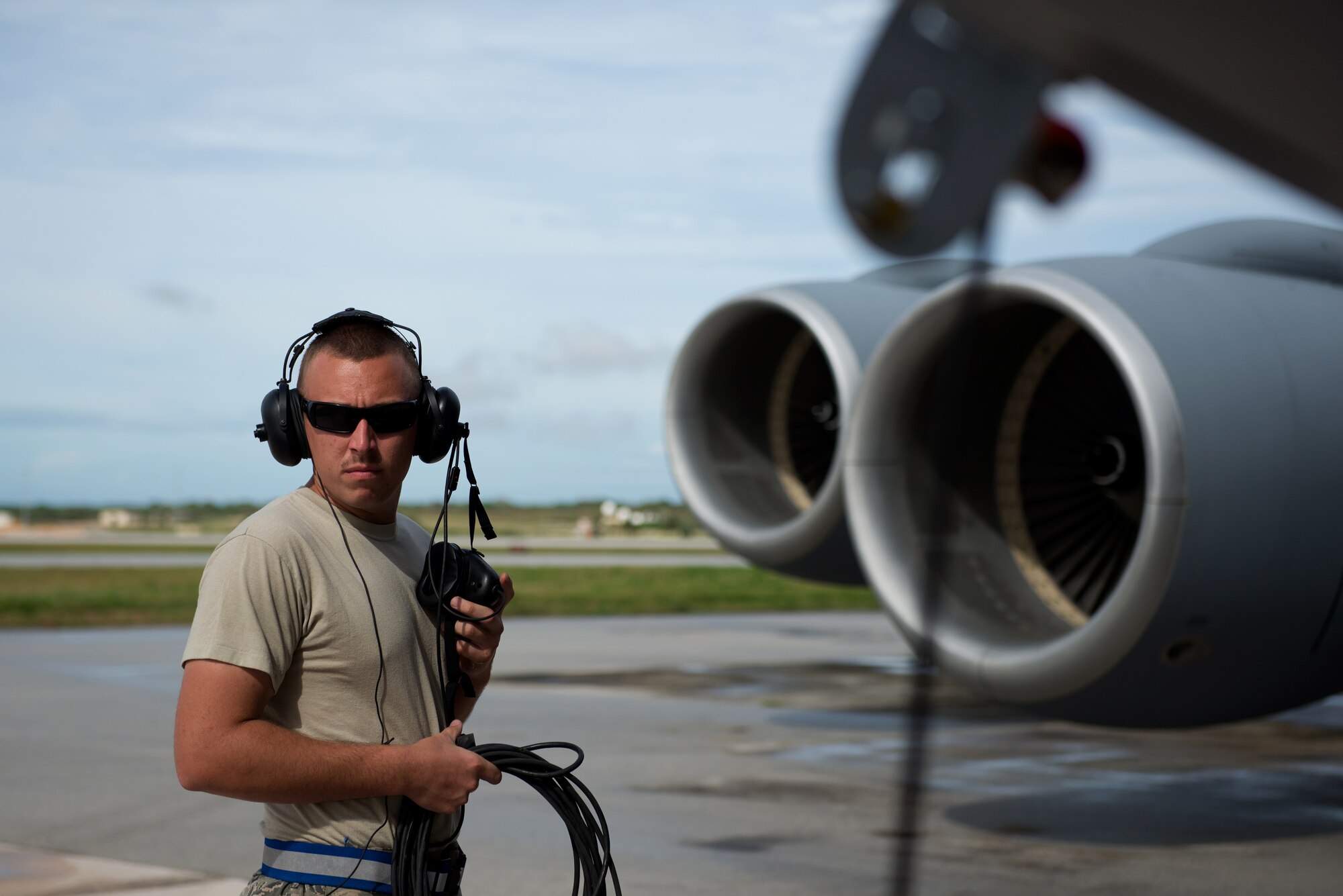 U.S. Air Force Airman 1st Class Adam Carignan inspects flight controls of a KC-135 Stratotanker, which is deployed to the 506th Expeditionary Air Refueling Squadron from the 157th Air Refueling Wing, N.H., as part of a preflight inspection, Jan. 21, 2015, Andersen AFB, Guam. Carignan is deployed as a crew chief to the 506 EARS, in support of the KC-135 mission to refuel Andersen’s current fighters, airlifter, and bombers’ along the Pacific region. (U.S. Air National Guard photo by Senior Airman Kayla McWalter/RELEASED)