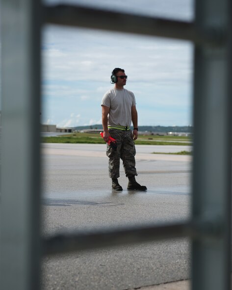 U.S. Air Force Staff Sgt. Kevin Harzbecker inspects flight controls of a KC-135 Stratotanker, which is deployed to the 506th Expeditionary Air Refueling Squadron from the 157th Air Refueling Wing, N.H., as part of a preflight inspection, Jan. 21, 2015, Andersen AFB, Guam. Harzbecker is deployed as a crew chief to the 506 EARS, in support of the KC-135 mission to refuel Andersen’s current fighters, airlifter, and bombers’ along the Pacific region. (U.S. Air National Guard photo by Senior Airman Kayla McWalter/RELEASED)