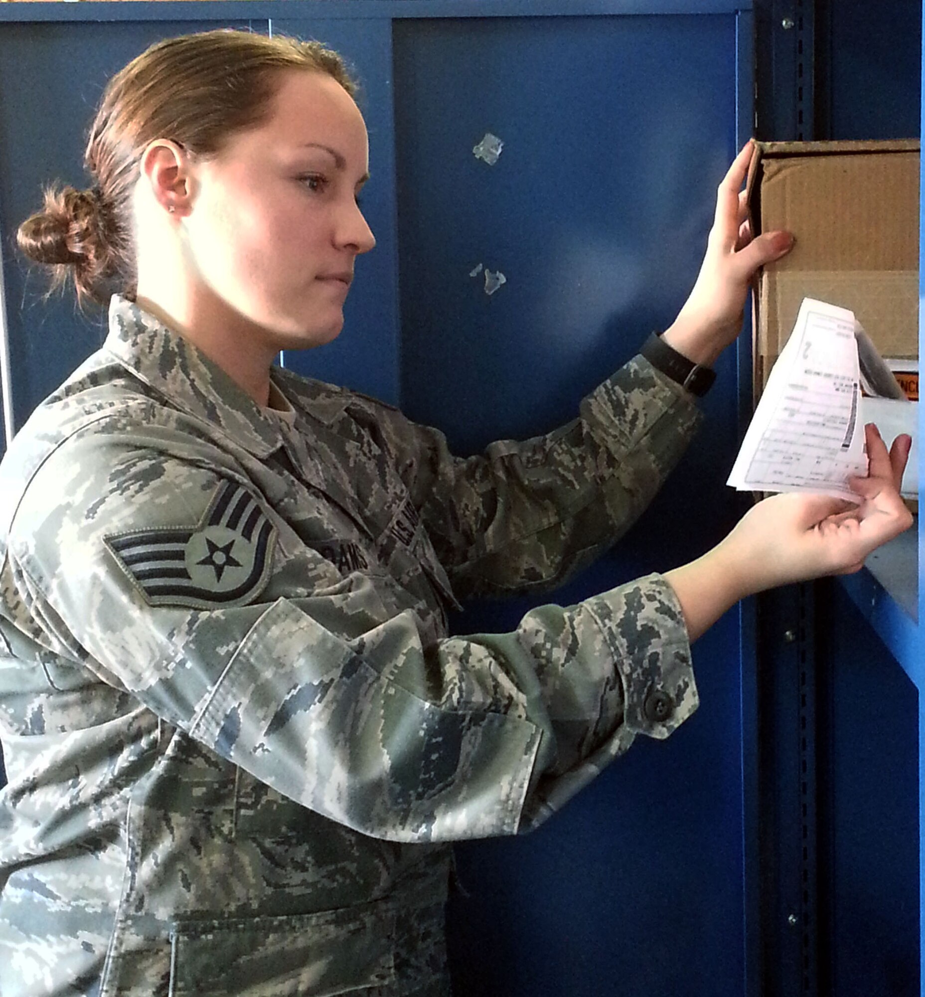 Staff Sgt. Brittany Adams, 111th Logistics Readiness Squadron supply management technician, stacks boxes of clothing supplies, March 6, 2015, Horsham Air Guard Station, Pennsylvania. The 111th Attack Wing is celebrating Women’s History Month by recognizing some of its own members throughout the month of March (U.S. Air National Guard Photo by Tech. Sgt. Andria Allmond/Released)

