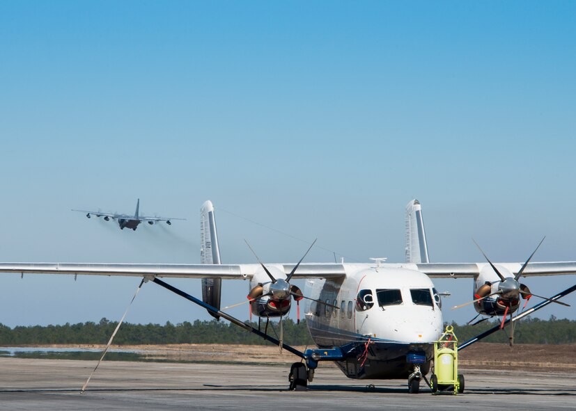 A C-145 Skytruck from the 919th Special Operations Wing waits for its next mission while a C-130 is doing some pattern work over Duke Field’s flightline Jan. 28. The Air Force Special Operations Command-owned C-145 Skytruck is now the primary aircraft on the 919th Special Operations Wing flightline at Duke Field. The aircraft is used in Aviation Foreign Internal Defense training, part of the special operations wing's mission. (U.S. Air Force photo/Tech. Sgt. Jasmin Taylor)