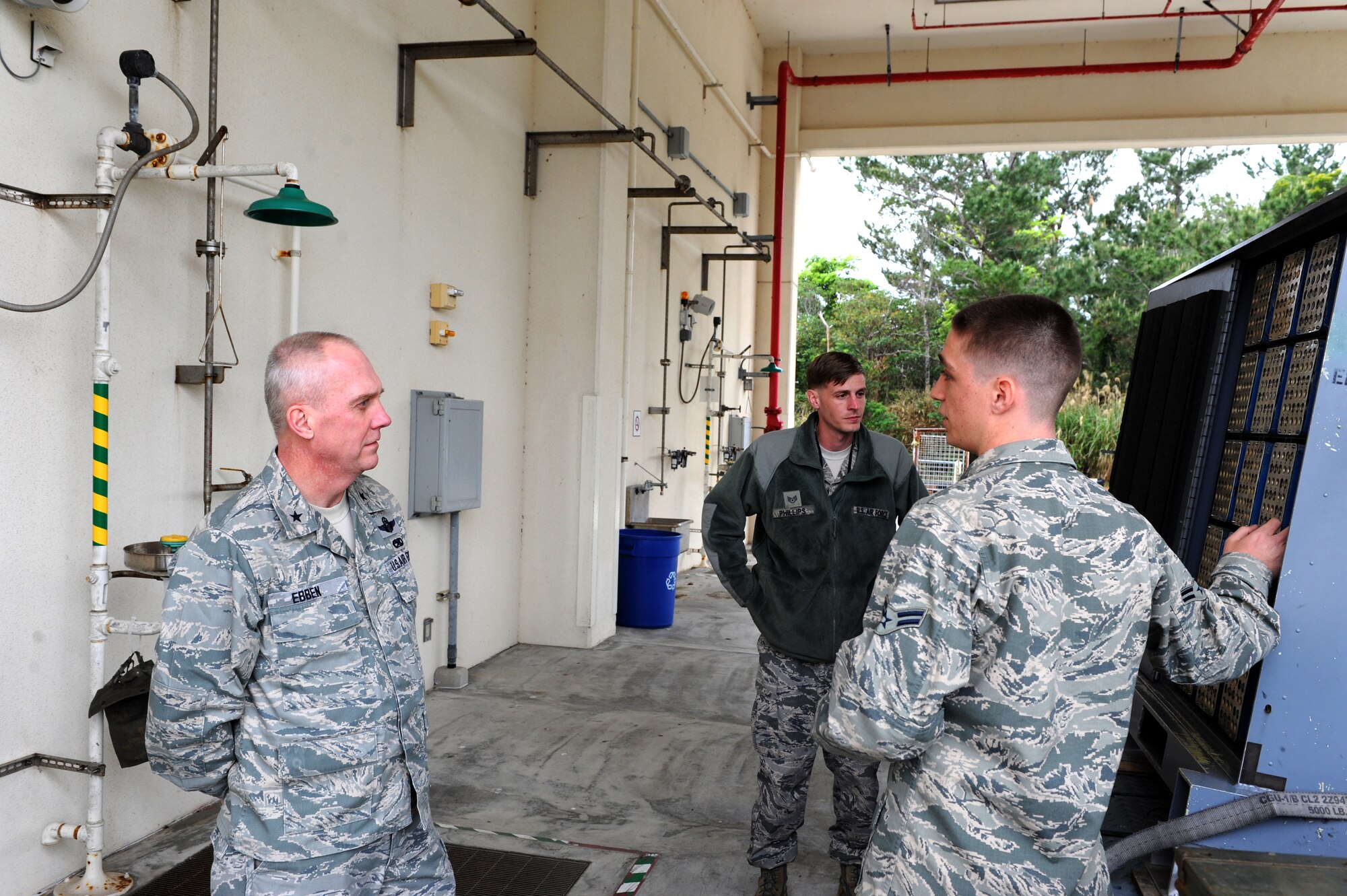 U.S. Air Force Airman 1st Class Henry Hasler, 18th Munitions Squadron conventional maintenance crew member, explains parts of his job to Brig. Gen. Gary Ebben, Wisconsin National Guard assistant adjutant general, on Kadena Air Base, Japan, March 4, 2015. Ebben came to Kadena to see how the members of the 115th Fighter Wing from Wisconsin were completing their mission while deployed to Kadena. (U.S. Air Force photo by Airman 1st Class Stephen G. Eigel) 