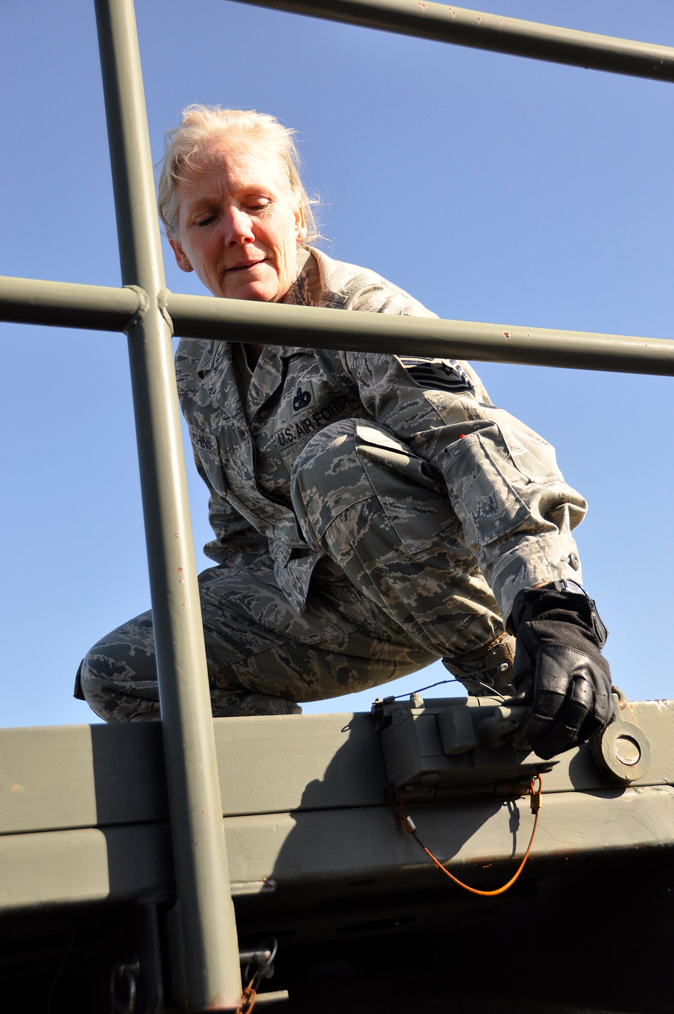 Senior Master Sgt. Wendy Hutchins, 86th Aerial Port Squadron port manager, inspects a next generation small loader, also known as a 25K loader, March 7, 2015, on the flightline. .