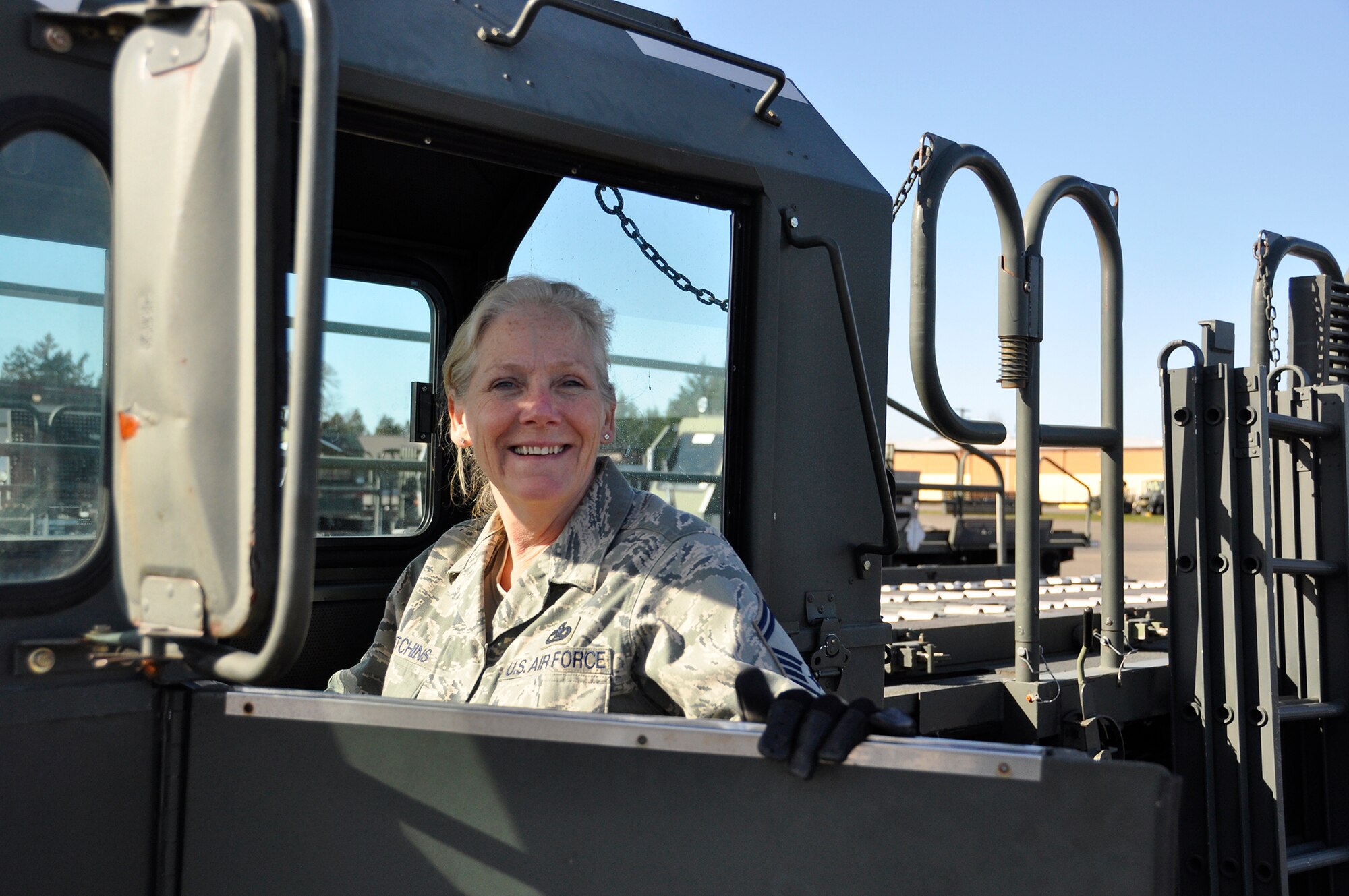 Senior Master Sgt. Wendy Hutchins, 86th Aerial Port Squadron port manager, poses for a photo March 7, 2015, on the flightline. Hutchins recently received the annual Outreach and Resource Services Award for her contributions toward helping women veterans.