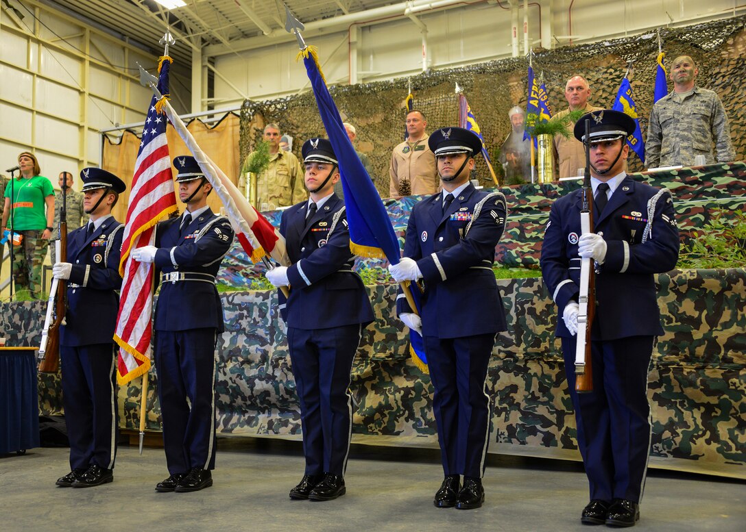 Members of the Eglin AFB Honor Guard present the colors at the Combat Dining-In Feb. 7 at Duke Field, Fla.  The event, the first in nine years, drew more than 250 Airmen.  A Combat Dining-In is built around the format of a traditional Dining-In, but there is less formality and combat uniforms are required. (U.S. Air Force photo/Tech. Sgt. Cheryl L. Foster)