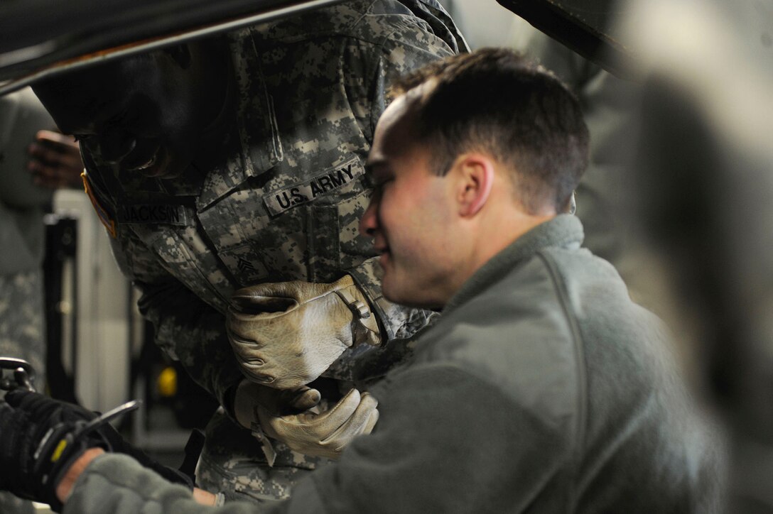 Airmen from the 317th Airlift Squadron, 38th and 81st Aerial Port Squadrons conduct a joint training scenario with the 1189th Transportation Brigade and the 941st Transportation Company at Joint Base Charleston – Air Base, S.C. March 7-8, 2015. This is the first time these units have facilitated this type of training where both branches of service worked side-by-side, executing weight and balance of vehicles, load planning, cargo buildup as well as the loading of equipment onto a C-17 Globemaster III. Soldiers and Airmen worked together over a two-day period to sharpen various transportation skills needed for their jobs. The 317 AS, 38 and 81 APS are assigned to the 315th Airlift Wing. The 1189th TSB and the 941st TSC are Reserve units that operate out of the JB Charleston – Weapons Station. (U.S. Air Force photo by Staff Sgt. Bobby Pilch)