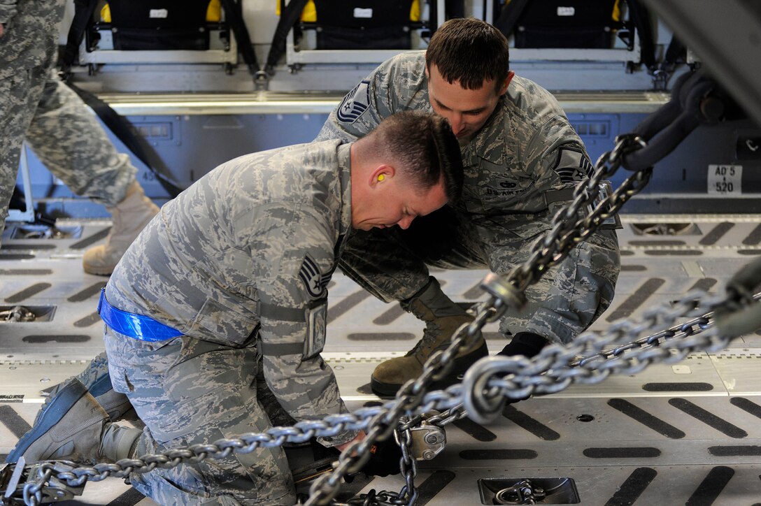 Airmen from the 317th Airlift Squadron, 38th and 81st Aerial Port Squadrons conduct a joint training scenario with the 1189th Transportation Brigade and the 941st Transportation Company at Joint Base Charleston – Air Base, S.C. March 7-8, 2015. This is the first time these units have facilitated this type of training where both branches of service worked side-by-side, executing weight and balance of vehicles, load planning, cargo buildup as well as the loading of equipment onto a C-17 Globemaster III. Soldiers and Airmen worked together over a two-day period to sharpen various transportation skills needed for their jobs. The 317 AS, 38 and 81 APS are assigned to the 315th Airlift Wing. The 1189th TSB and the 941st TSC are Reserve units that operate out of the JB Charleston – Weapons Station. (U.S. Air Force photo by Staff Sgt. Bobby Pilch)