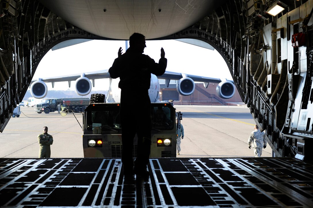 Airmen from the 317th Airlift Squadron, 38th and 81st Aerial Port Squadrons conduct a joint training scenario with the 1189th Transportation Brigade and the 941st Transportation Company at Joint Base Charleston – Air Base, S.C. March 7-8, 2015. This is the first time these units have facilitated this type of training where both branches of service worked side-by-side, executing weight and balance of vehicles, load planning, cargo buildup as well as the loading of equipment onto a C-17 Globemaster III. Soldiers and Airmen worked together over a two-day period to sharpen various transportation skills needed for their jobs. The 317 AS, 38 and 81 APS are assigned to the 315th Airlift Wing. The 1189th TSB and the 941st TSC are Reserve units that operate out of the JB Charleston – Weapons Station. (U.S. Air Force photo by Staff Sgt. Bobby Pilch)