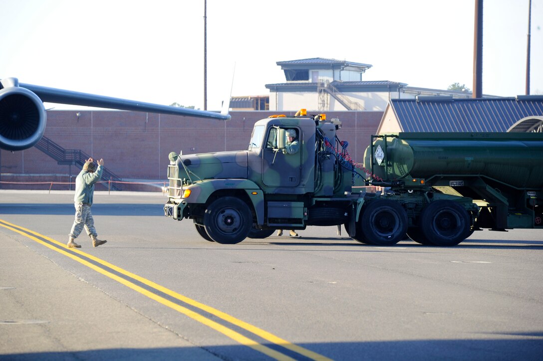 Airmen from the 317th Airlift Squadron, 38th and 81st Aerial Port Squadrons conduct a joint training scenario with the 1189th Transportation Brigade and the 941st Transportation Company at Joint Base Charleston – Air Base, S.C. March 7-8, 2015. This is the first time these units have facilitated this type of training where both branches of service worked side-by-side, executing weight and balance of vehicles, load planning, cargo buildup as well as the loading of equipment onto a C-17 Globemaster III. Soldiers and Airmen worked together over a two-day period to sharpen various transportation skills needed for their jobs. The 317 AS, 38 and 81 APS are assigned to the 315th Airlift Wing. The 1189th TSB and the 941st TSC are Reserve units that operate out of the JB Charleston – Weapons Station. (U.S. Air Force photo by Staff Sgt. Bobby Pilch)