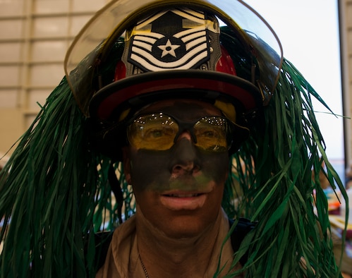 Chief Master Sgt. Peter Webb, 919th Special Operations Civil Engineer Squadron, dons his war gear at the Combat Dining-In Feb 7 at Duke Field, Fla.  The event, the first in nine years, drew more than 250 Airmen.  A Combat Dining-In is built around the format of a traditional Dining-In, but there is less formality and combat uniforms are required. (U.S. Air Force photo/Tech. Sgt. Jasmin Taylor)