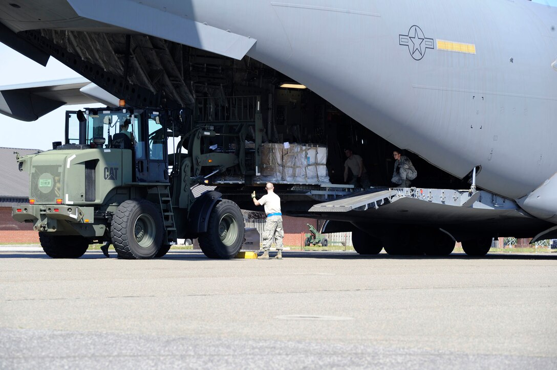 Airmen from the 81st Aerial Port Squadron at Joint Base Charleston, South Carolina trained with members from the 934th Airlift Wing's 27 APS, Minneapolis-St. Paul International Airport Air Reserve Station, Minn. here March 7-8, 2015.  The purpose of the joint training was to allow Airmen from the 81 APS an opportunity to practice loading and off-loading a C-130 aircraft while also preparing for the upcoming Port Dawg Challenge.  Airmen from the 27 APS were exposed to the Global Air Transpiration Execution System, a single post/terminal processing and management system for the Department of Defense. (U.S. Air Force photo by Staff Sgt. Bobby Pilch)
