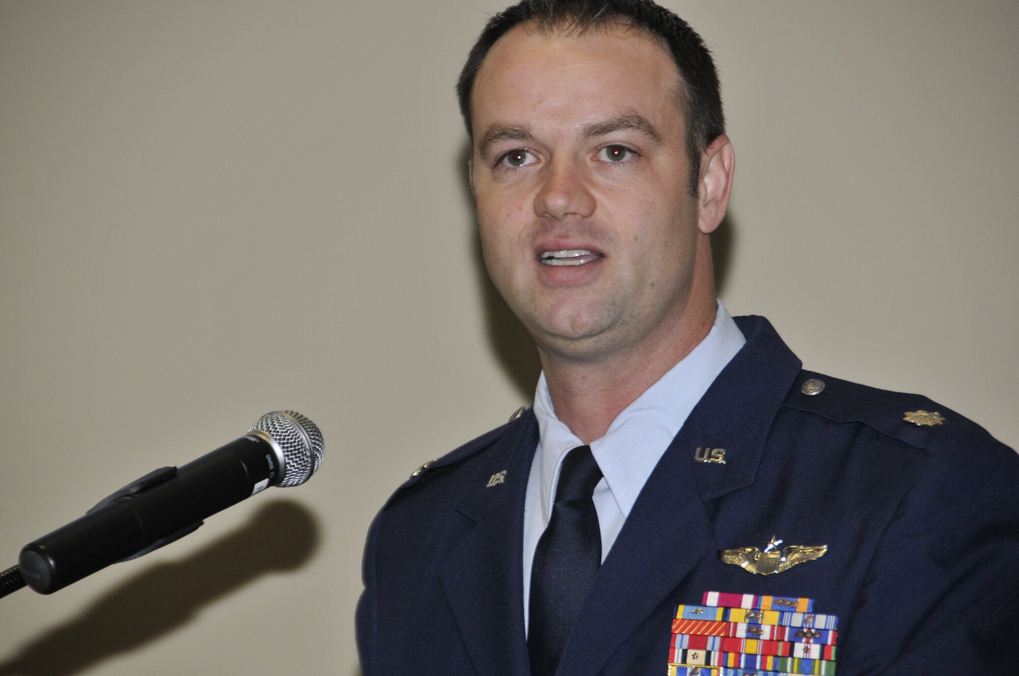 Lt. Col. Jeremiah Gentry, 184th Attack Squadron commander, addresses the audience during an assumption of command ceremony held March 8, 2015 at Ebbing Air National Guard Base, Fort Smith, Ark. Gentry, a former A-10 Thunderbolt II "Warthog", MQ-9 Reaper and F-16 Falcon pilot, served on active duty for 11 years before transitioning to the Arkansas Air National Guard. (U.S. Air National Guard photo by Staff Sgt. John Suleski/released)
