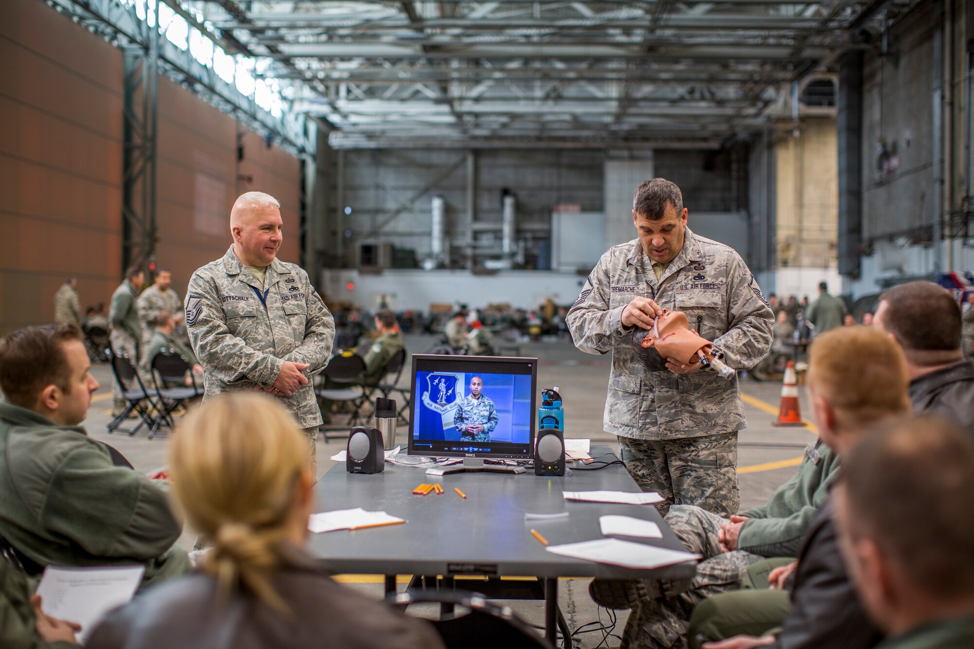 Master Sgt. Tim Tremarche, 101st Intelligence Squadron signals intelligence element supervisor, demonstrates how to use a nasal flange to 102nd Intelligence Wing Airmen March 6, 2015 at Otis Air National Guard Base, Mass. Approximately 350 Airmen from the 102nd IW participated in hands-on training which covered self-aid buddy care and chemical, biological, radiological and nuclear defense. (Air National Guard photo by Staff Sgt. Jeremy Bowcock)