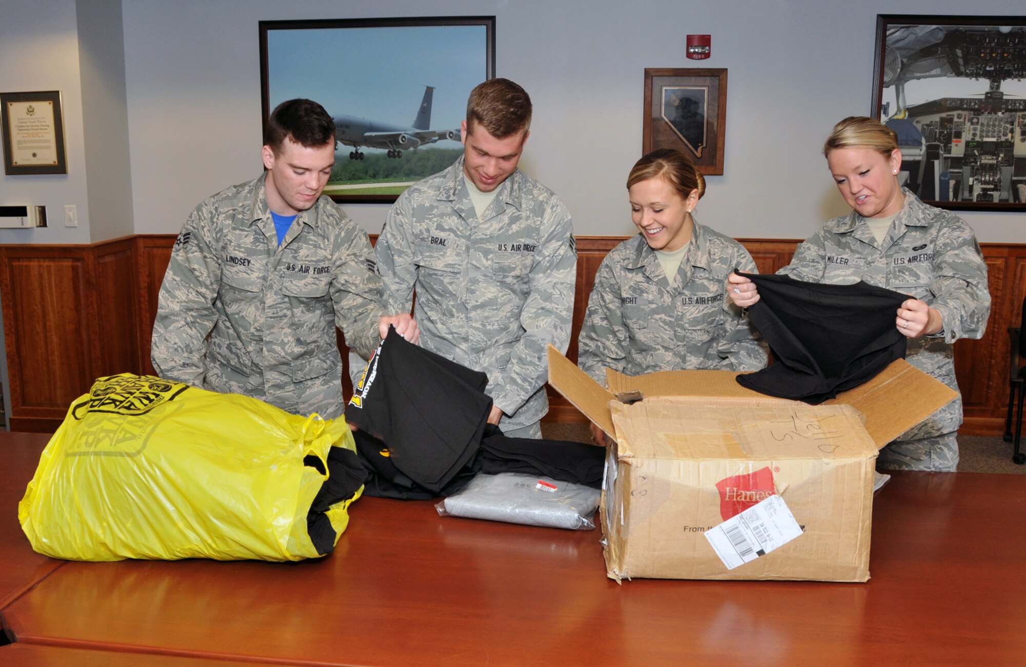 Members of the 185 Air Refueling Wing Junior Enlisted Council (JEC) box up shirts in a classroom at the base in Sioux City, Iowa on Sunday, March 8, 2015. The members of the JEC are collecting donated clothes for the Wounded Warrior Project to help out wounded military members at the Landstuhl hospital in Germany.  (U.S. Air National Guard photo by TSgt. Bill Wiseman/Released)