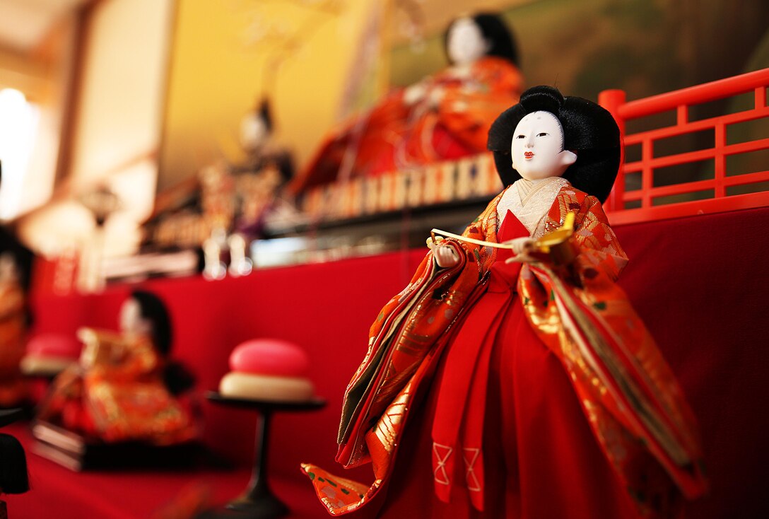 Residents of Marine Corps Air Station Iwakuni, Japan, celebrate the Japanese Doll Festival “Hinamatsuri,” with Yusu No Sato, a cultural outreach group based in Iwakuni City, Feb. 27, 2015. Coordinated by the Cultural Adaption Program aboard station, participants helped display “hina-ningyo,” a seven-tiered stand presenting the special dolls of Hinamatsuri that celebrates young girl’s growth and happiness.