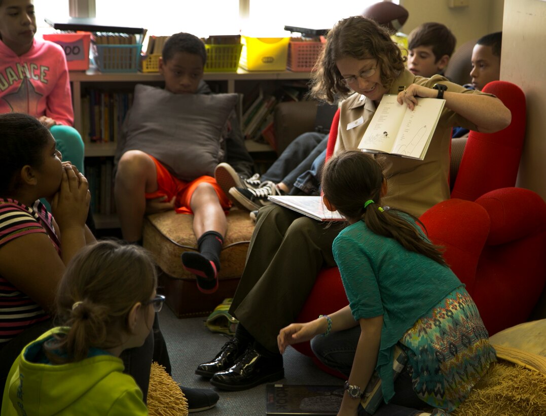 Capt. Sarah K. Raley reads a story about insects to a 5th grade class during National Read Across America Day March 2 at Camp Kinser Elementary School, Okinawa, Japan.  Read Across America Day is observed every year on March 2, which is also the birthday of Theodor Seuss Geisel, better known as Dr. Seuss, the writer and cartoonist of internationally acclaimed children’s books, including “The Cat in the Hat.” Every year, service members and civilians stationed on Okinawa volunteer to read to students at elementary schools on U.S. military bases across the island, and the children are encouraged to read and share their favorite stories with their class. Raley is a native of Austin, Texas, and watch officer with the Staff Judge Advocate, Marine Corps Installations Pacific-Marine Corps Base Camp Butler, Japan. 