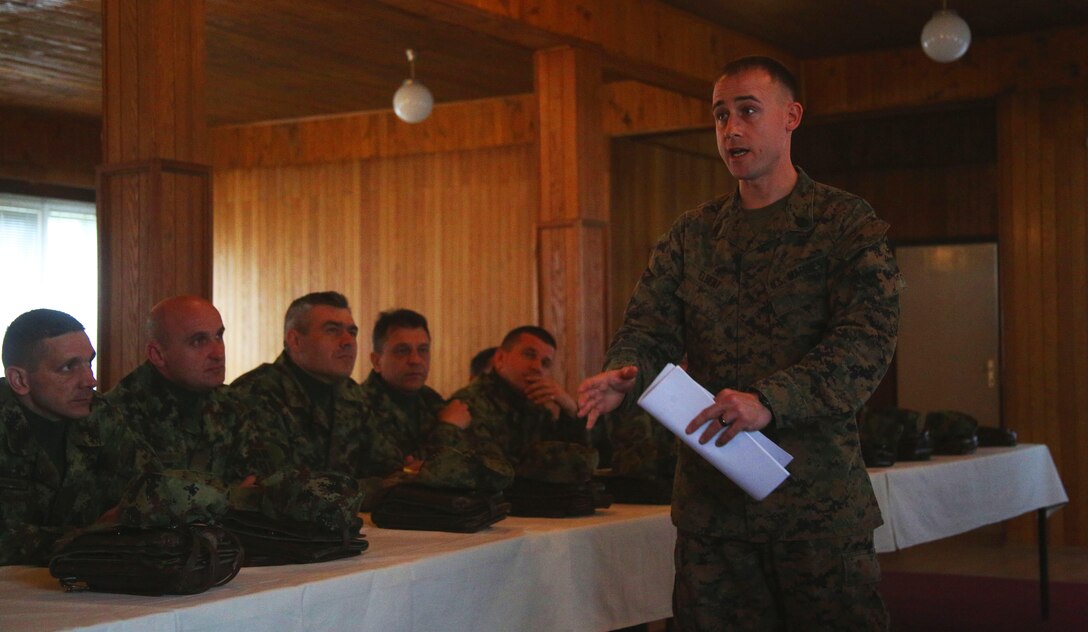 U.S. Marine Corps Staff Sgt. Dale Elbert, with Black Sea Rotational Force supporting the NCO workshop in Serbia, speaks to the group of senior noncommissioned officers at an NCO Workshop at the Serbian Armed Forces Training Center Pancevo, March 3-6, 2015. 25 Serbian Armed Forces service members worked with four U.S. Marines in an effort to share information about the noncommissioned officer rank and role and responsibilities of a platoon sergeant. This engagement allowed for a greater understanding in Serbia’s effort in working toward NATO interoperability in the area of leader development. (U.S. Marine Corps photo by 1st Lt. Sarah E. Burns)