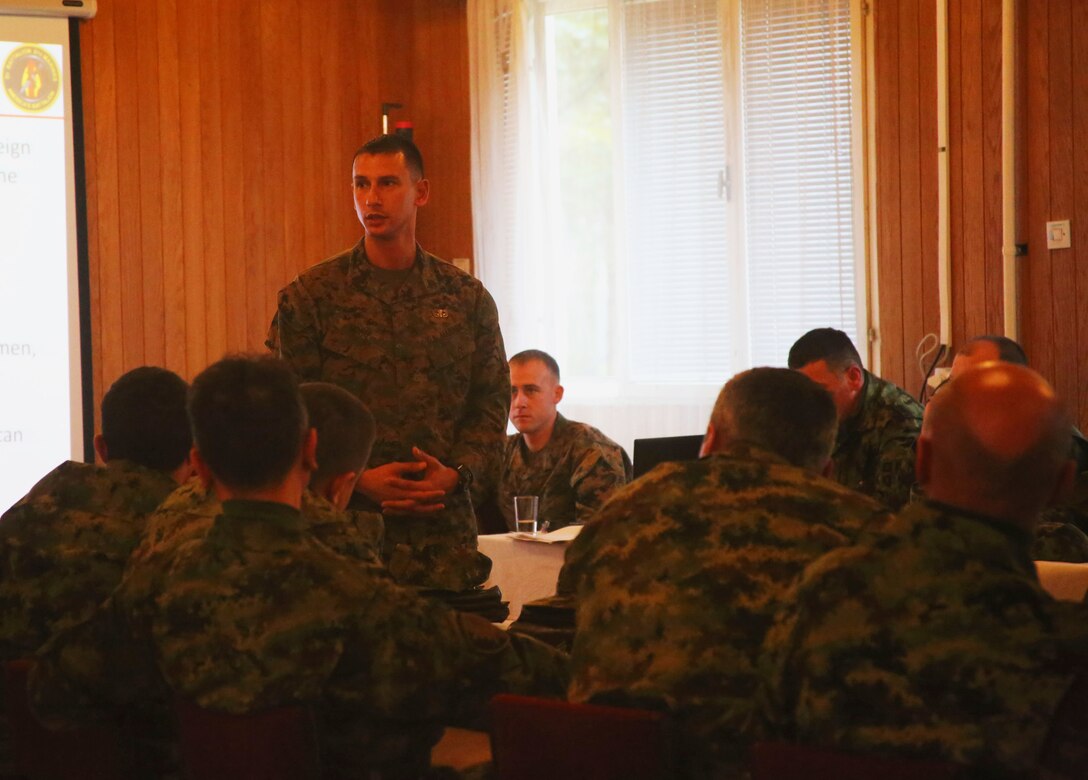 U.S. Marine Corps Staff Sgt. Jonathan Sidhu, with Black Sea Rotational Force supporting the NCO workshop in Serbia, speaks to the group of senior noncommissioned officers at an NCO Workshop at the Serbian Armed Forces Training Center Pancevo, March 3-6, 2015.  Serbian Armed Forces service members engaged with four U.S. Marines in an effort to share information about the noncommissioned officer rank and role and responsibilities of a platoon sergeant. This engagement allowed for a greater understanding in Serbia’s effort in working toward NATO interoperability in the area of leader development. (U.S. Marine Corps photo by 1st Lt. Sarah E. Burns)