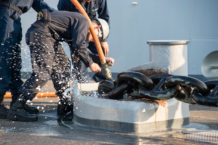 150302-N-XG464-086 - ARABIAN GULF (March 2, 2015) - Boatswain's Mate Seaman Robert Tracey, from Bangor, Maine, assigned to the amphibious transport dock ship USS New York (LPD 21), cleans the anchor chain during an anchoring evolution aboard the amphibious transport dock ship USS New York (LPD 21). New York is a part of the Iwo Jima Amphibious Ready Group (ARG) and, with the embarked 24th Marine Expeditionary Unit (MEU), is deployed in support of maritime security operations and theater security cooperation efforts in the U.S. 5th Fleet area of operations. (U.S. Navy photo by Mass Communication Specialist 3rd Class Jonathan B. Trejo/Released)