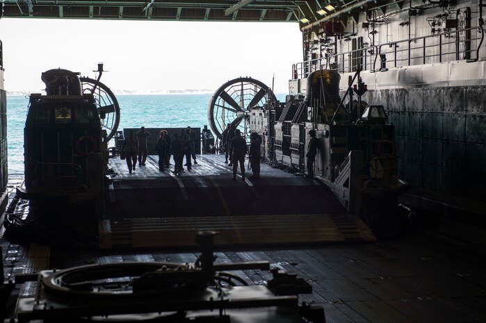 150301-N-XG464-183 -ARABIAN GULF (March 1, 2015) - Distinguished visitors prepare to debark from the amphibious transport dock ship USS New York (LPD 21) on a Landing Craft Air Cushion (LCAC) upon completion of a disguised-visitors tour. New York is a part of the Iwo Jima Amphibious Ready Group (ARG) and, with the embarked 24th Marine Expeditionary Unit (MEU), is deployed in support of maritime security operations and theater security cooperation efforts in the U.S. 5th Fleet area of operations. (U.S. Navy photo by Mass Communication Specialist 3rd Class Jonathan B. Trejo/Released)