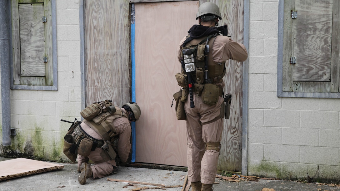 A Marine with 2nd Force Reconnaissance Detachment 6 sets up a 3-strand detonation cord to the door of a building to prepare for an explosive breach during a close-quarters tactics training event at Expeditionary Operations Training Group compound at Stone Bay aboard Marine Corps Base Camp Lejeune, N.C., March 6, 2015.  Marines with 2nd FRD 6 used mechanical and explosive breaching techniques with explosive charges to assist in clearing a 3 story building while at the reconnaissance and surveillance course conducted by EOTG.