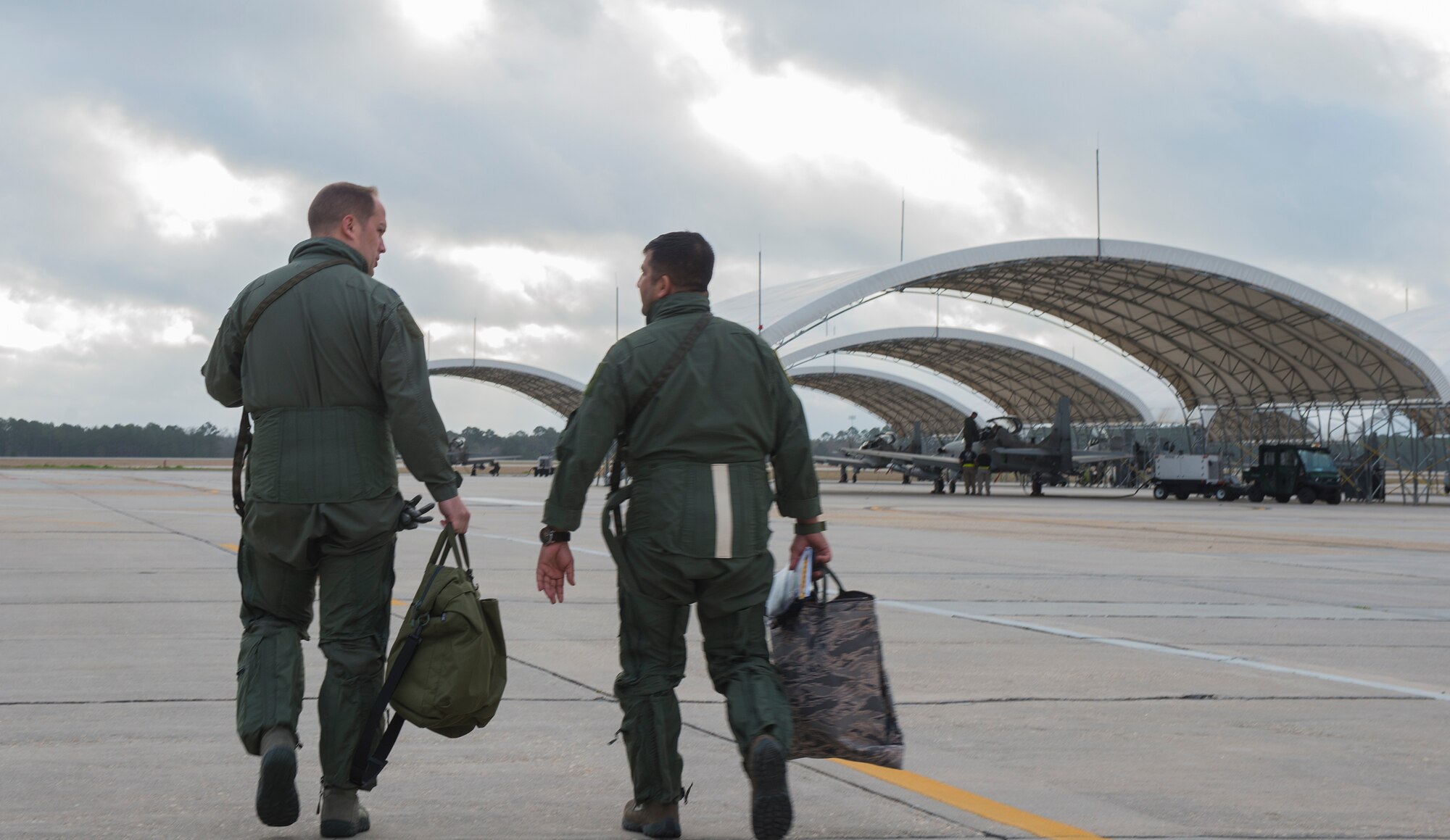 U.S. Air Force Lt. Col. Jeffrey Hogan, left, 81st Fighter Squadron commander, speaks to an Afghan Air Force student pilot from the 81st FS, before the first Afghan ‘in seat’ flight in an A-29 Super Tucano March 5, 2015, at Moody Air Force Base, Ga. The Afghan pilots completed classroom instruction and simulator training before the first flight. (U.S. Air Force photo by Airman 1st Class Ceaira Tinsley)