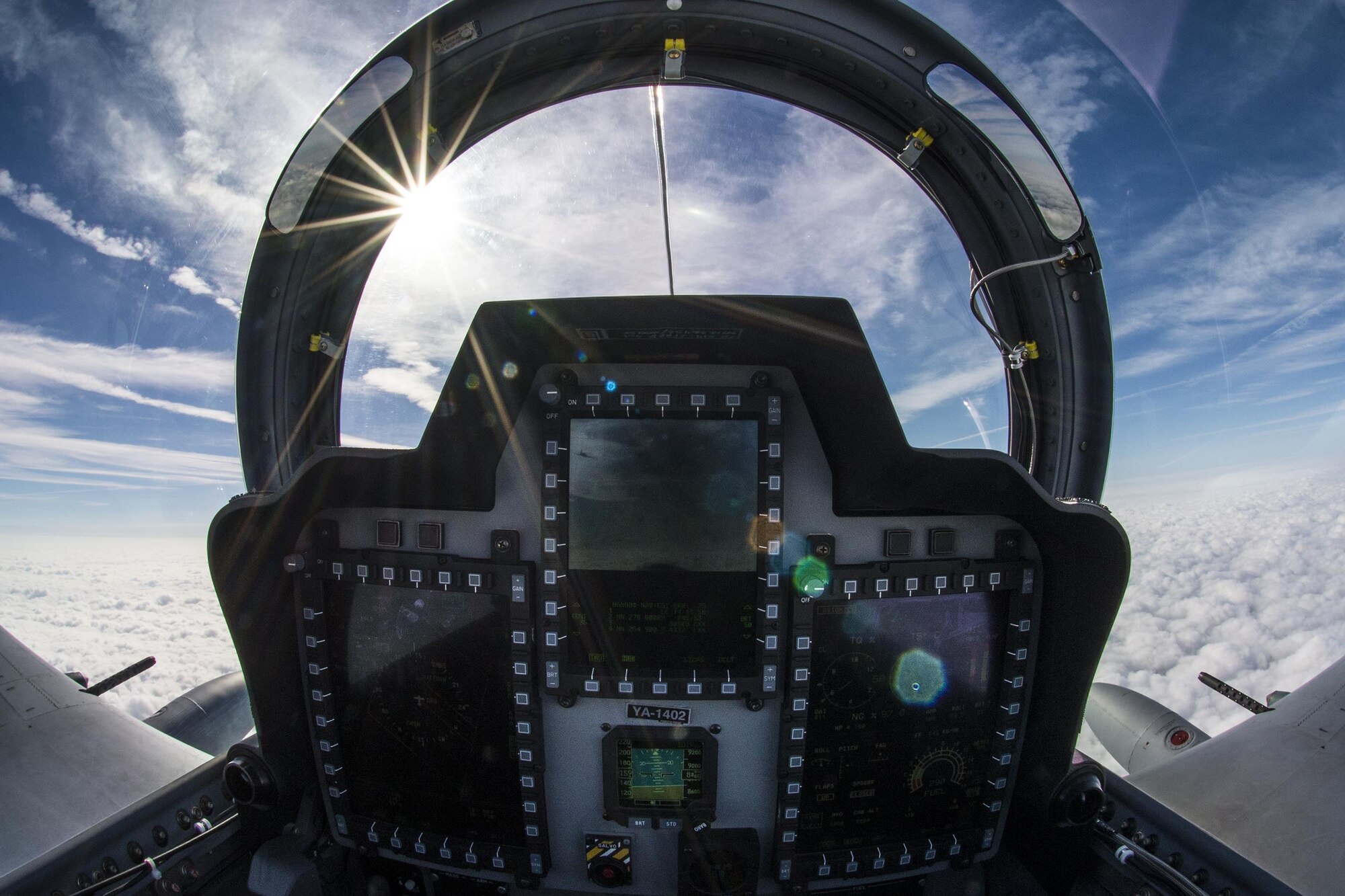 The sun illuminates the rear cockpit of an A-29 Super Tucano during flight March 5, 2015, in the skies over Moody Air Force Base, Ga. The 81st Fighter Squadron is using the aircraft to train Afghan Air Force pilots and maintainers. (U.S. Air Force Photo by Senior Airman Ryan Callaghan)