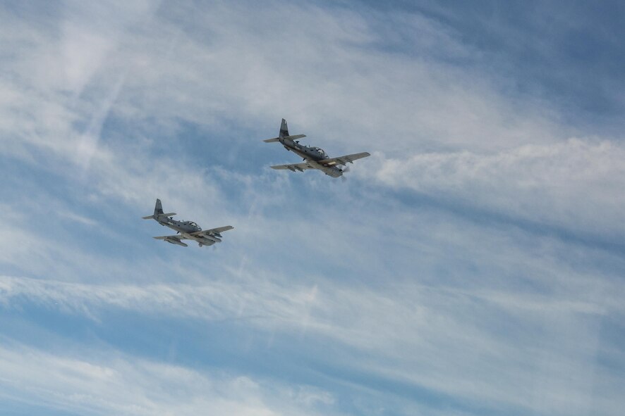 Two A-29 Super Tucanos from the 81st Fighter Squadron fly in formation March 5, 2015, in the skies over Moody Air Force Base, Ga. The formation was the first time an Afghan Air Force student pilot flew while assigned to the 81st FS. (U.S. Air Force Photo by Senior Airman Ryan Callaghan)