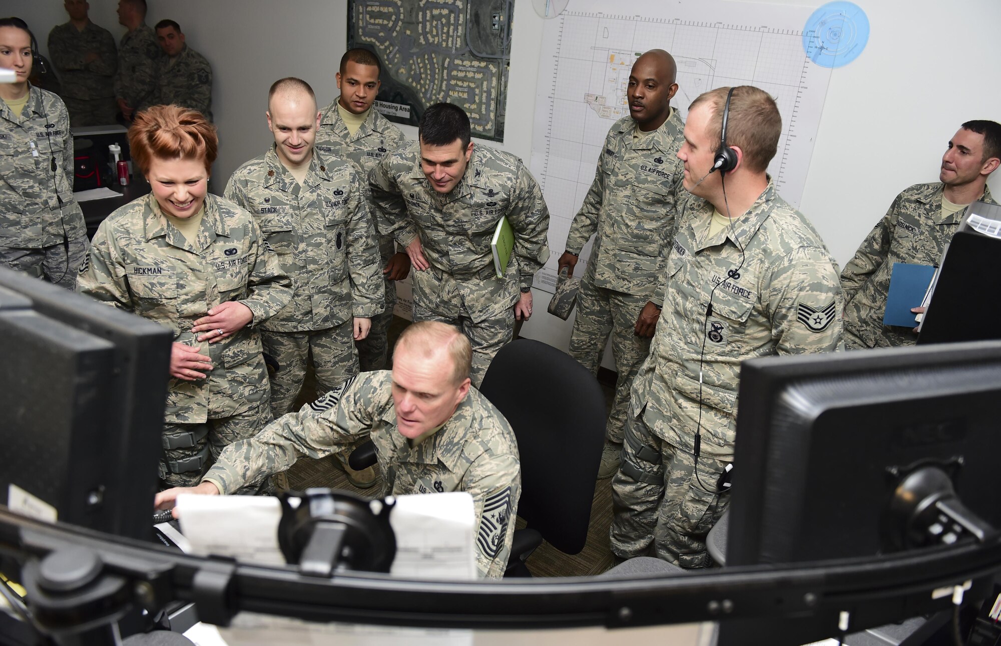 Chief Master Sgt. of the Air Force James A. Cody tests out the new base defense operations center in the 460th Security Forces Squadron March 5, 2015, at Buckley Air Force Base, Colo. Cody toured Buckley AFB and spoke with Airmen on the future of the Air Force. (U.S. Air Force photo/Airman 1st Class Luke W. Nowakowski)