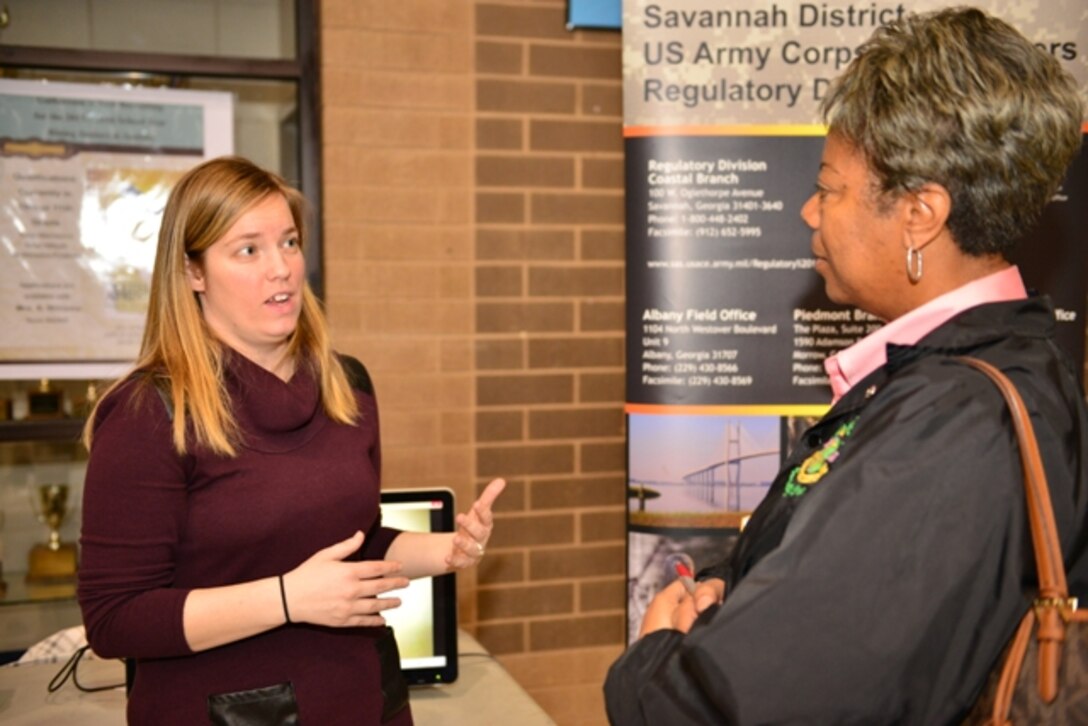 Sarah Wise, Corps regulatory specialist, discusses outreach events supported by the Corps at Savannah’s 9th annual Megagenesis held Feb. 28 at Sol C. Johnson High School. Volunteers spent the day speaking with Savannah area students about internships and careers with the Corps. The event featured a college fair, career workshops and guest speaker Patricia Russell McCloud, a prominent motivational speaker, author and lawyer based in Atlanta, Ga. The event aims to promote a college-going culture by providing college and career information to students and parents, according to the website (USACE photo by Chelsea Smith.)