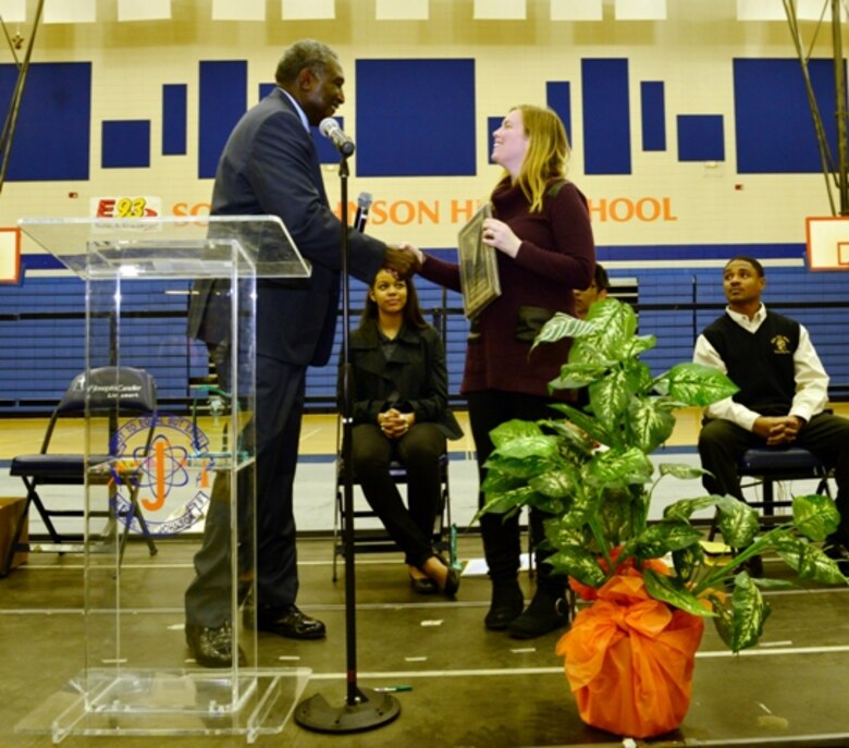 Sarah Wise, Corps regulatory specialist, accepts the district’s award of appreciation from Megagenesis director, Dr. Zke Zimmerman, presented to recognize the district’s consistent support at the annual event. Corps volunteers spent the day speaking with Savannah area students about internships and careers with the Corps at the event held Feb. 28 at Sol C. Johnson High School in Savannah. The event aims to promote a college-going culture by providing college and career information to students and parents, according to the website