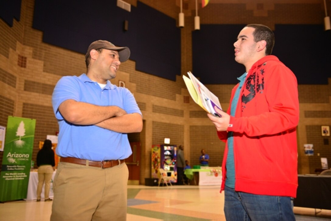 Joseph Rivera, Corps regulatory specialist, speaks with a student attendee at Savannah’s 9th annual Megagenesis held Feb. 28 at Sol C. Johnson High School in Savannah. Rivera traveled from the Corps office in Morrow, Ga. to participate in the event which featured a college fair, career workshops and guest speaker Patricia Russell McCloud, a prominent motivational speaker, author and lawyer based in Atlanta, Ga. Corps volunteers spent the day speaking with Savannah area students about internships and careers with the Corps. The event aims to promote a college-going culture by providing college and career information to students and parents, according to the website