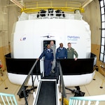 South African Maj. Gen. Wiseman Mbambo, left, and Brig. Gen. Mashoro Phala stand with New York Air National Guard Col. Timothy LaBarge, center, commander of the 105th Airlift Wing, after experiencing a flight in the New York Air National Guard's state of the art C-17 Simulator on Monday, March 2, 2015. Mbomba and Phala visited Stewart Air National Guard Base in Newburgh, New York, as part of the South African National Defence Force's State Partnership Program relationship with the New York National Guard. 