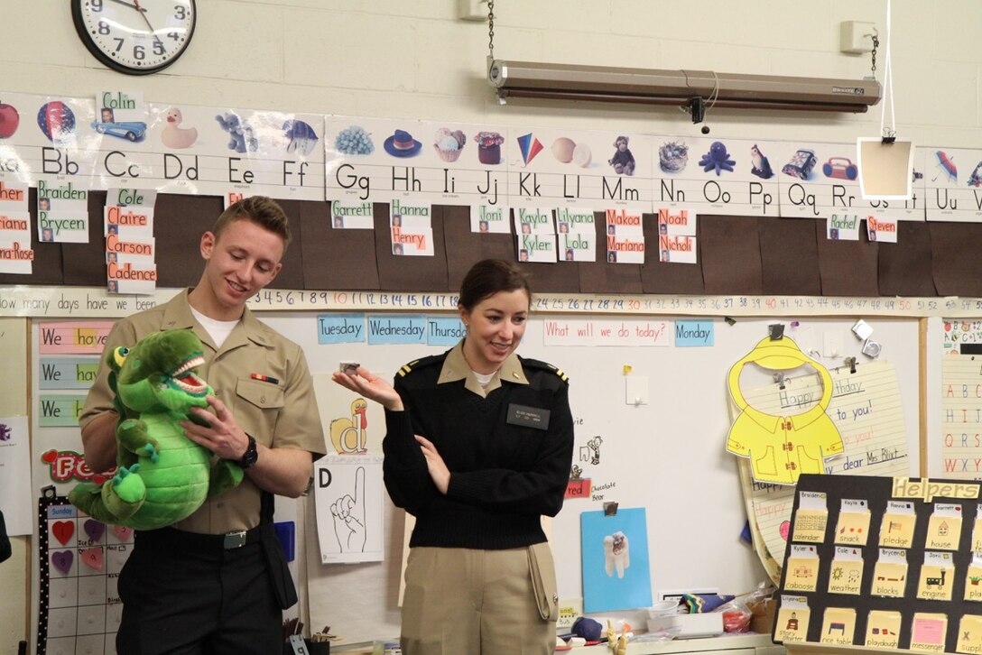 Navy Lt. Elise V. Hurrell, Naval Health Clinic Quantico, department head, Marine Corps Air Field Annex Dental Clinic, speaks with students during a recent visit to Russell Elementary School to promote dental hygiene awareness as part of February’s National Children’s Dental Health Awareness Month. 