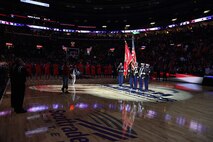 Marines with Recruiting Station St. Louis, along with MSgt. Mark A Kennedy, presented the nations colors and sang the National Anthem at the Arch Madness Basketball Tournament March 8 at Scott Trade Center, St. Louis. The tournament was for the Missouri Valle Conference Championship. Kennedy is the senior enlisted advisor at Military Processing Station St. Louis.