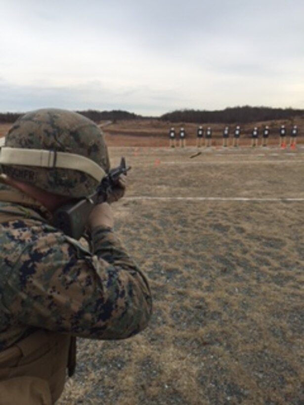 A Marine from Bravo Company, Marine Barracks Washington, D.C. engages a target during a company-sized Combat Marksmanship Program live-fire training exercise in Quantico, Va.