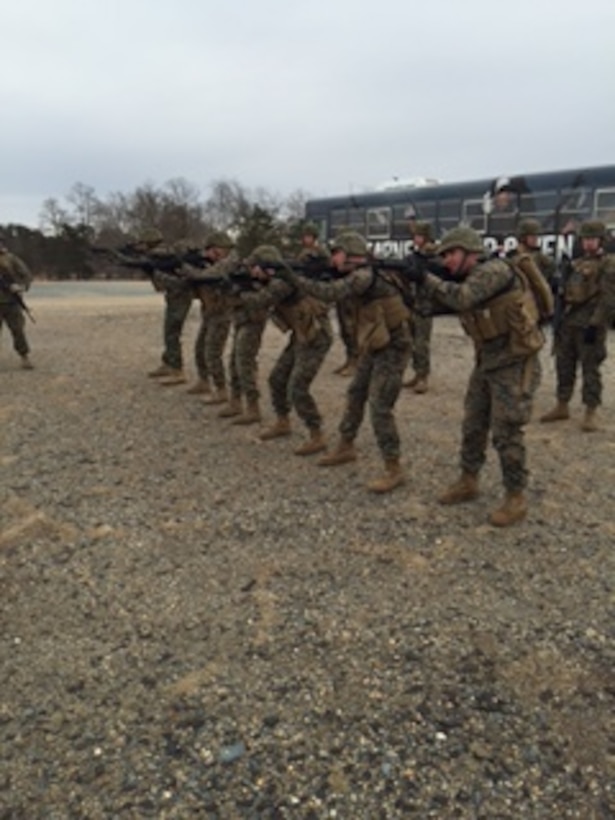 Marines from Bravo Company, Marine Barracks Washington, D.C. engage a target during a company-sized Combat Marksmanship Program live-fire training exercise in Quantico, Va.