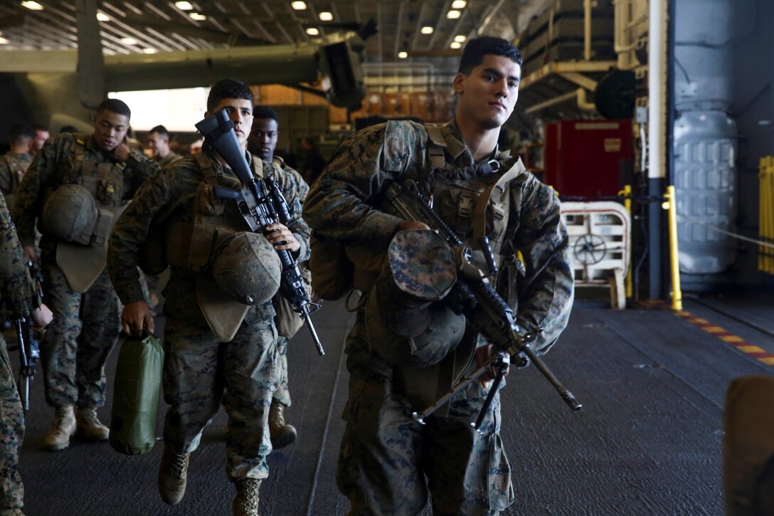U.S. Marines with Battalion Landing Team 3rd Battalion, 1st Marine Regiment, 15th Marine Expeditionary Unit, depart the USS Essex (LHD 2) during Amphibious Squadron/Marine Expeditionary Unit Integration Training (PMINT) off the coast of San Diego March 5, 2015. These Marines were executing a simulated amphibious assault on Camp Pendleton, Calif. (U.S. Marine Corps photo by Cpl. Anna Albrecht/ Released)