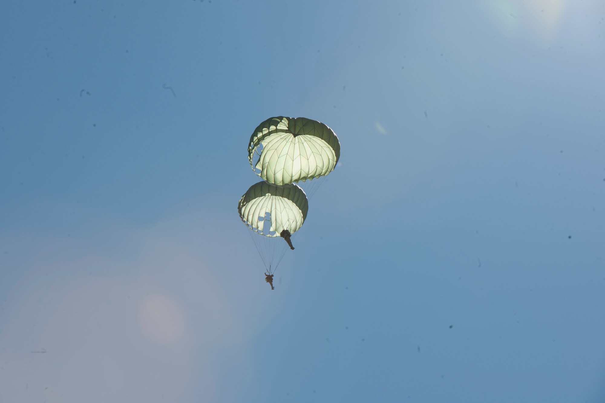 Airmen from the 820th Base Defense Group call out their positions to ensure they remain a safe distance apart Feb. 19, 2015, at Tifton Air Field, Ga. 820th BDG “Defenders” jump often to maintain their qualifications. (U.S. Air Force photo by Staff Sgt. Eric Summers Jr./Released)