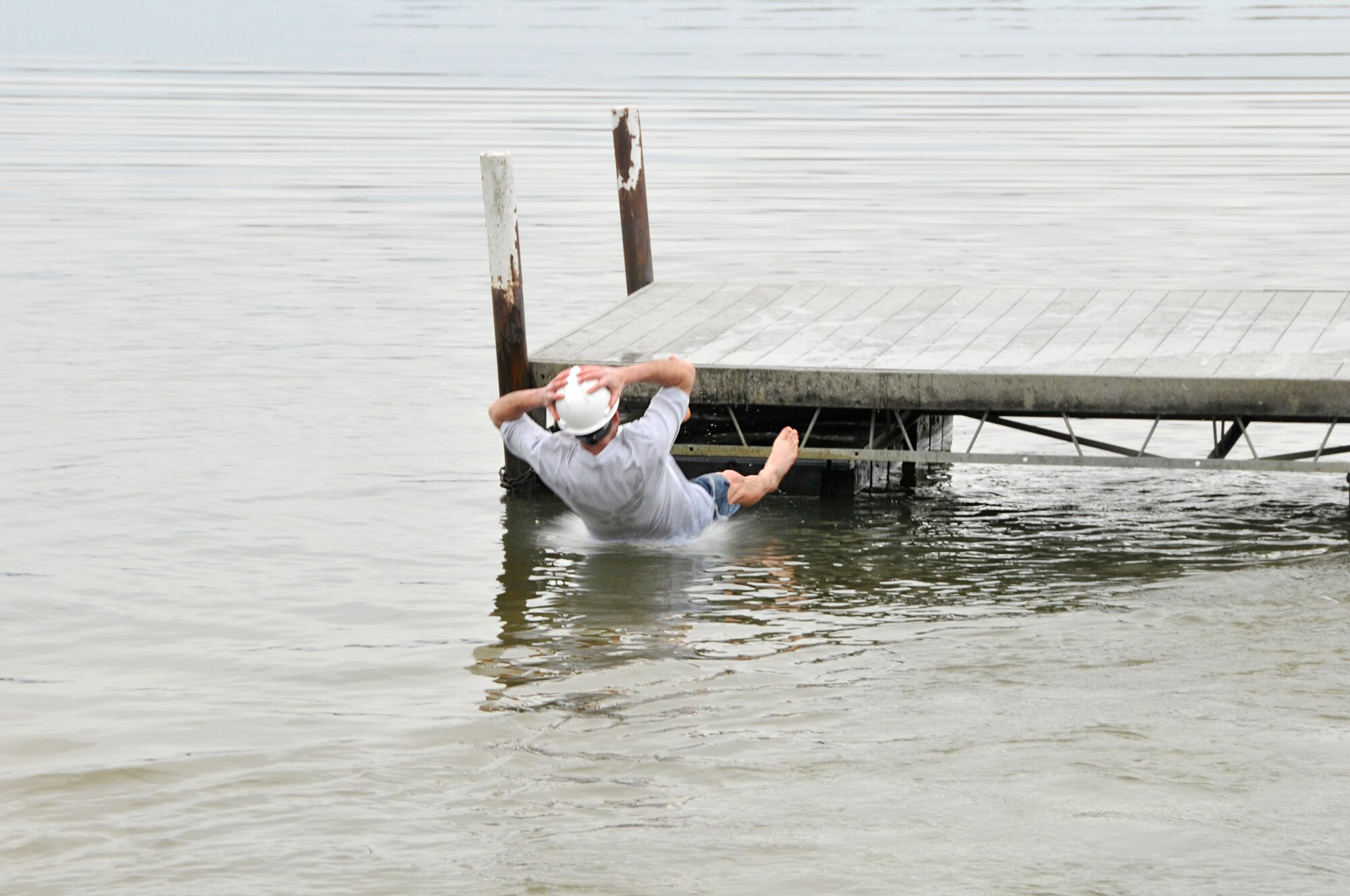 Tennessee has experienced frigid temperatures and snowy weather recently, but this didn’t stop a group of officers, government civilians and contractors from jumping into the freezing Woods Reservoir on Wednesday, Feb. 25. The high for that day was 36 degrees Farenheit. The Company Grade Officers’ Council (CGOC) hosted its Polar Bear Plunge, a fundraiser in which donations are pledged in someone’s name and then he or she must either pay up or take a leap into the lake. All donations go toward events and charities on base or in the local area that are supported by the CGOC. Pictured here in these photos is Lt. Col. Jay Orson as he takes his plunge. (Photos by Jacqueline Cowan)
