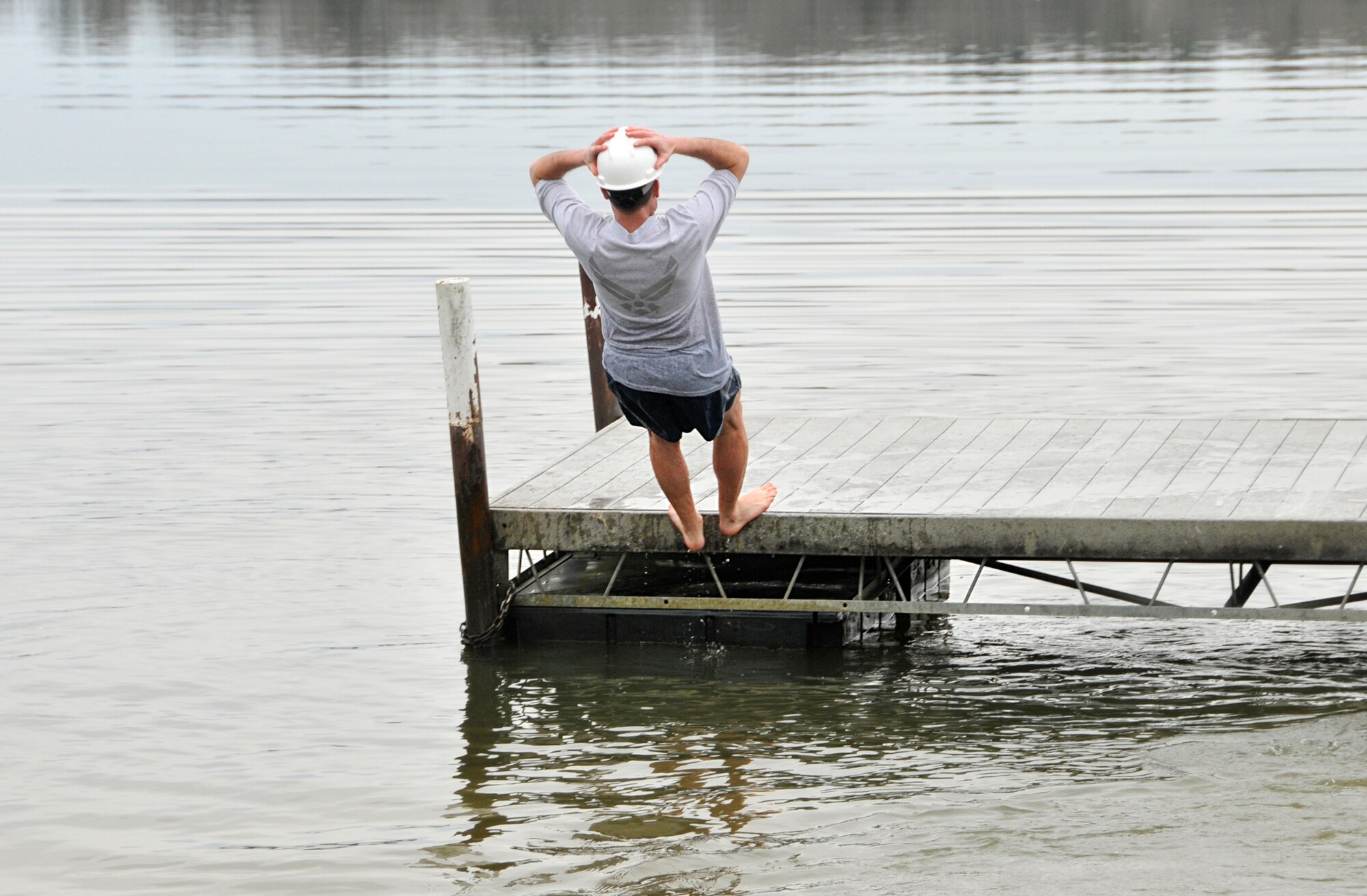 Tennessee has experienced frigid temperatures and snowy weather recently, but this didn’t stop a group of officers, government civilians and contractors from jumping into the freezing Woods Reservoir on Wednesday, Feb. 25. The high for that day was 36 degrees Farenheit. The Company Grade Officers’ Council (CGOC) hosted its Polar Bear Plunge, a fundraiser in which donations are pledged in someone’s name and then he or she must either pay up or take a leap into the lake. All donations go toward events and charities on base or in the local area that are supported by the CGOC. Pictured here in these photos is Lt. Col. Jay Orson as he takes his plunge. (Photos by Jacqueline Cowan)