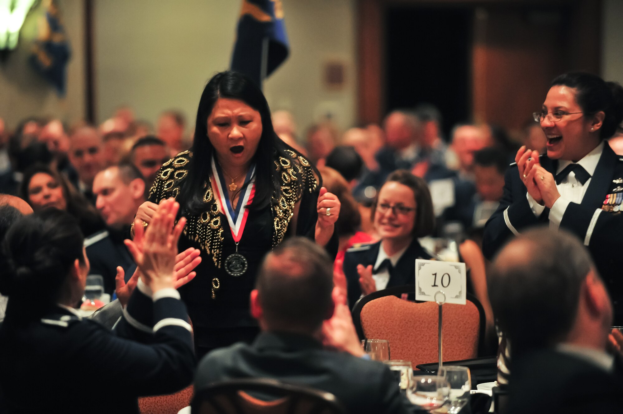 Mercedita M. Sabijon is shocked as she hears that she's won an award March 6, 2015, during the 310th Space Wing's Annual Awards Banquet at the Cheyenne Mountain Resort in Colorado Springs, Colo. Sabijon is chief of the 310th SW Financial Management office. The wing sponsored the event to both recognize its annual award winners and bring Reservists together to enjoy an evening of esprit de corps, unit morale and camaraderie.
(U.S. Air Force photo/Tech. Sgt. Nicholas B. Ontiveros)