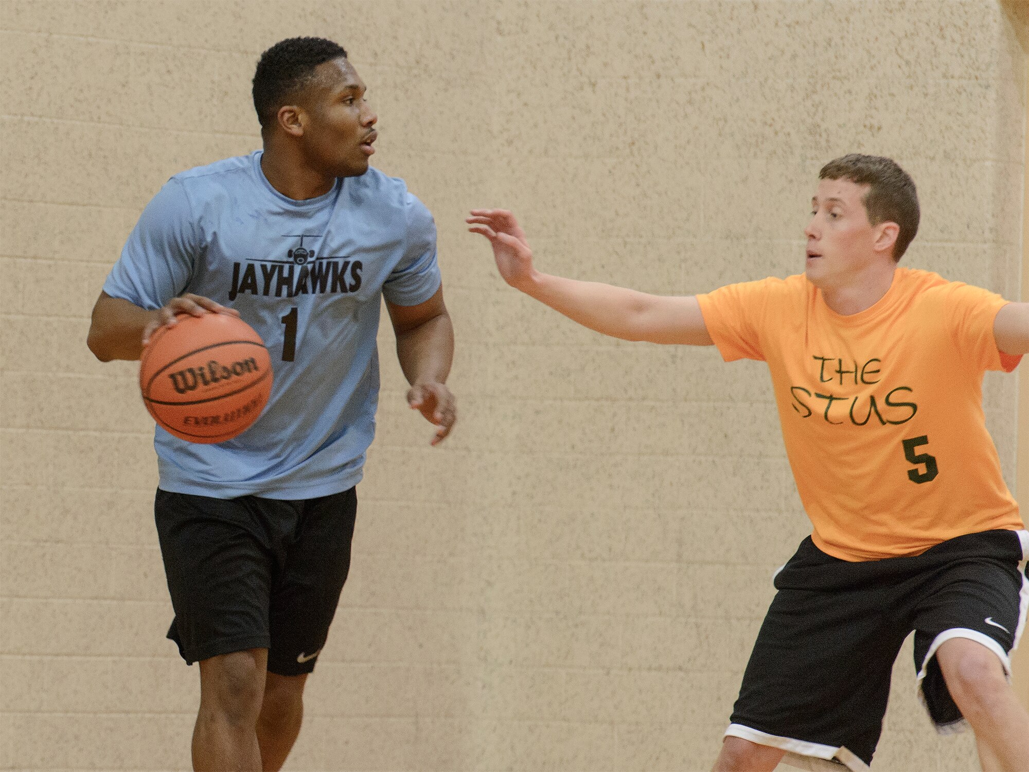 VANCE AIR FORCE BASE, Okla. -- 3rd Flying Training Squadron Jayhawk Graham Davis looks for an open teammate at Bradley Fitness and Sports Center, Feb. 25. (U.S. Air Force photo / David Poe)