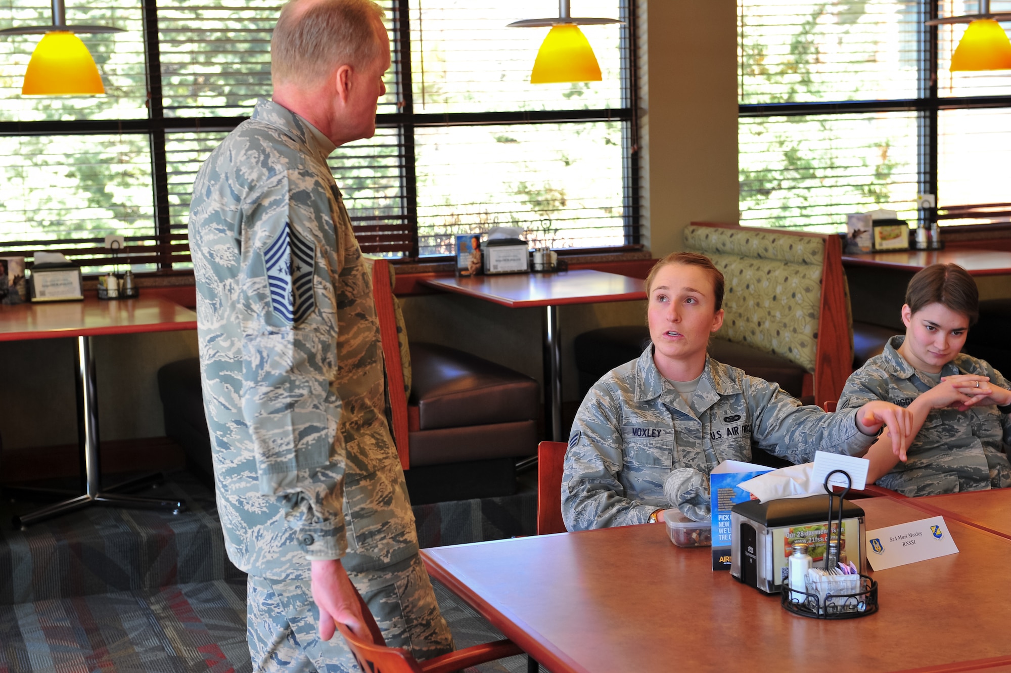 Chief Master Sgt. of the Air Force James A. Cody listens to feedback from Senior Airman Mari Moxley at the Aragon dining facility March 7, 2015, during a private forum on Peterson Air Force Base, Colo. This was part of Cody's two-day visit with the 310th Space Wing, Schriever Air Force Base, Colo.
(U.S. Air Force photo/Tech. Sgt. Nicholas B. Ontiveros)
