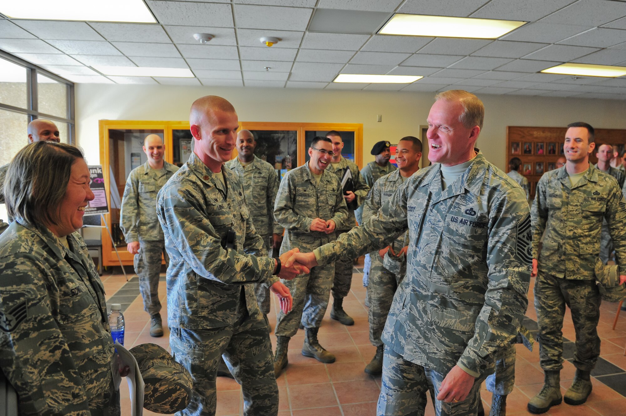 Chief Master Sgt. of the Air Force James A. Cody meets Maj. Justin L. Long, 50th Force Support Squadron commander, before entering the Satellite Dish dining facility March 6, 2015, during a guided tour of the 310th Space Wing on Schriever Air Force Base, Colo.  Cody spoke to Airmen, answered questions during an all-call and recognized several Airmen for their contributions to the 310th SW during his two-day visit.
(U.S. Air Force photo/Tech. Sgt. Nicholas B. Ontiveros)