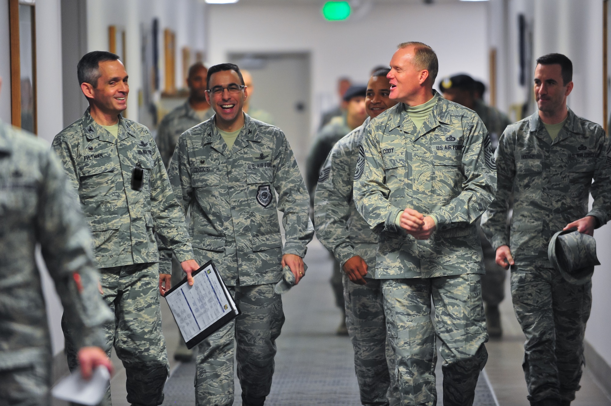 Chief Master Sgt. of the Air Force James A. Cody walks with escorts Air Force Reserve Col. Damon S. Feltman, 310th Space Wing commander and Col. Bill Liquori, 50th Space Wing commander, March 6, 2015, during a guided tour of the 310th Space Wing on Schriever Air Force Base, Colo.  Cody spoke to Airmen, answered questions during an all-call and recognized several Airmen for their contributions to the 310th SW during his two-day visit.
(U.S. Air Force photo/Tech. Sgt. Nicholas B. Ontiveros)