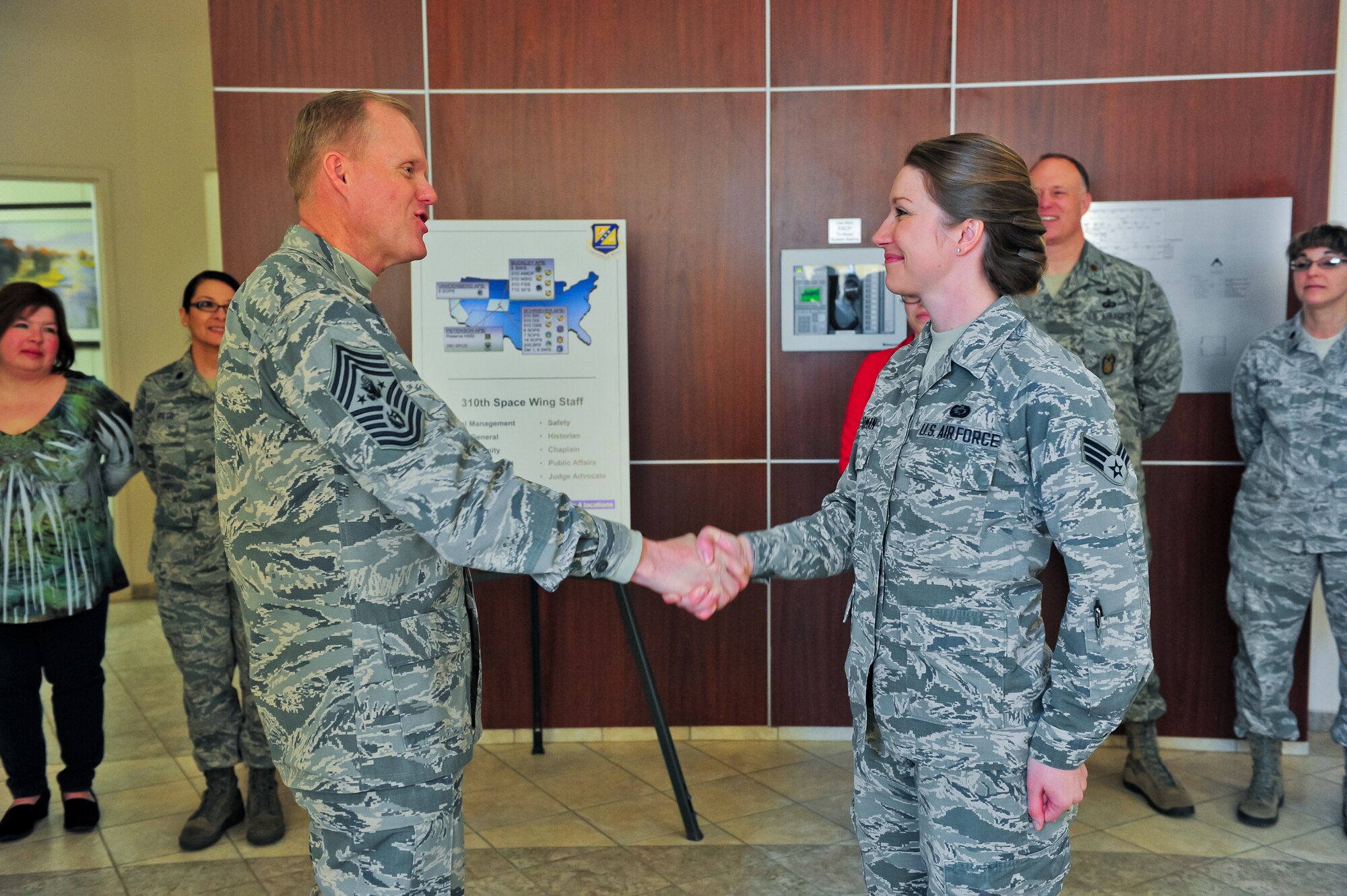 Chief Master Sgt. of the Air Force James A. Cody introduces himself to Air Force Reserve Senior Airman Sheena M. Boardman March 6, 2015, during a guided tour of the 310th Space Wing on Schriever Air Force Base, Colo. Cody recognized her contributions to the 310th SW as a high performer during his two-day visit.
(U.S. Air Force photo/Tech. Sgt. Nicholas B. Ontiveros)